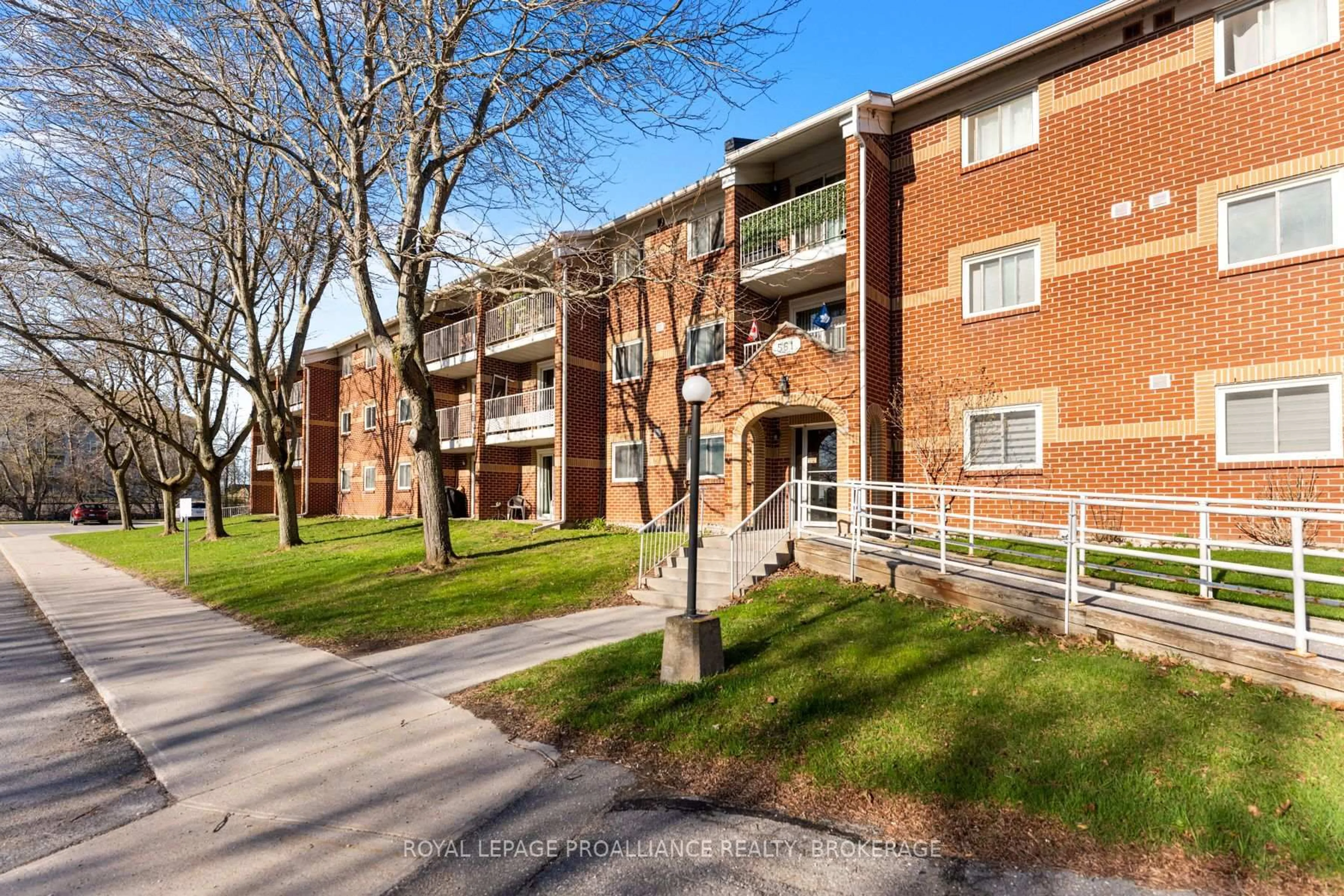 A pic from outside/outdoor area/front of a property/back of a property/a pic from drone, street for 561 Armstrong Rd #206, Kingston Ontario K7M 8J9