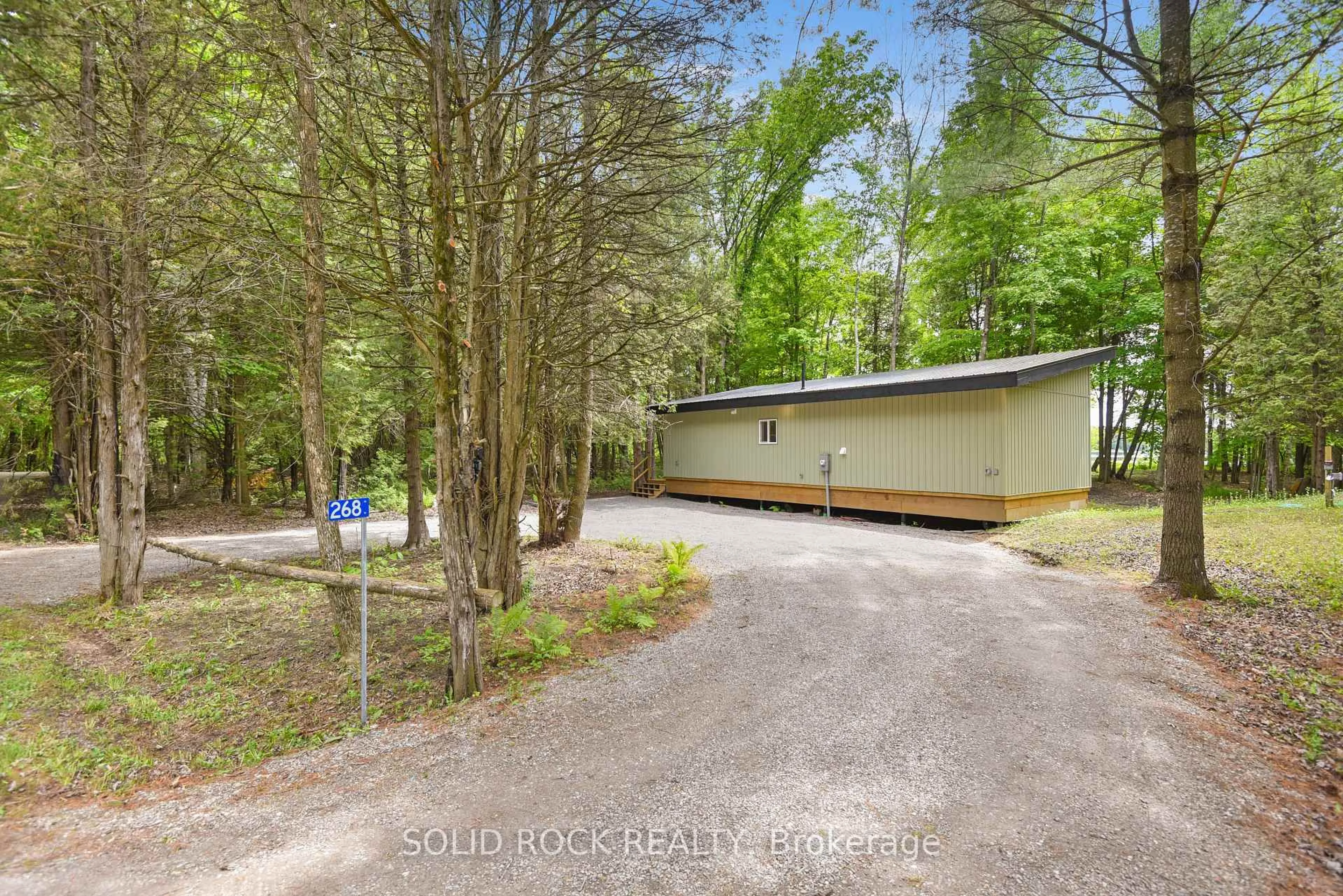 A pic from outside/outdoor area/front of a property/back of a property/a pic from drone, forest/trees view for 268 Cedar Sands Rd, Rideau Lakes Ontario K0E 1G0