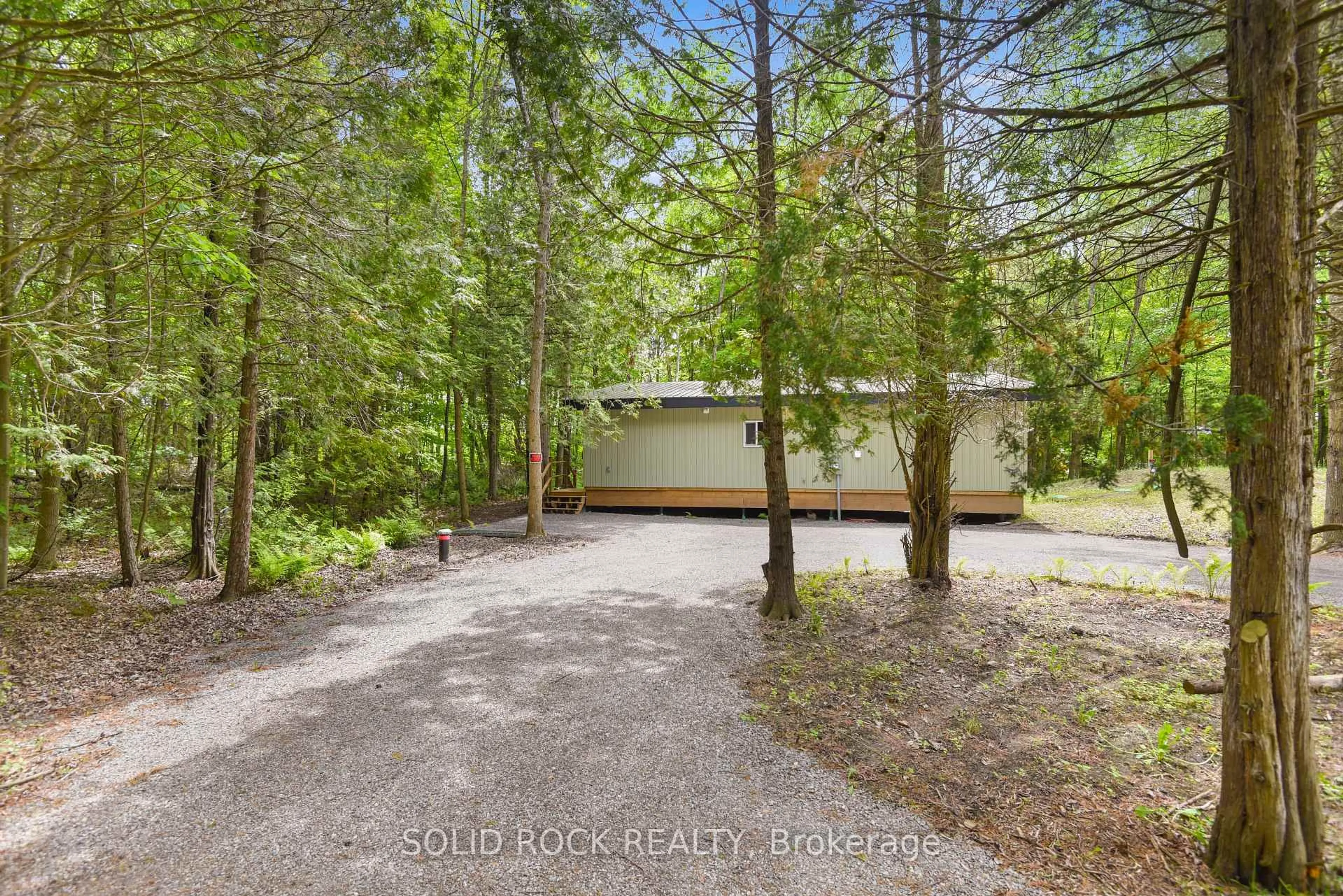A pic from outside/outdoor area/front of a property/back of a property/a pic from drone, forest/trees view for 268 Cedar Sands Rd, Rideau Lakes Ontario K0E 1G0