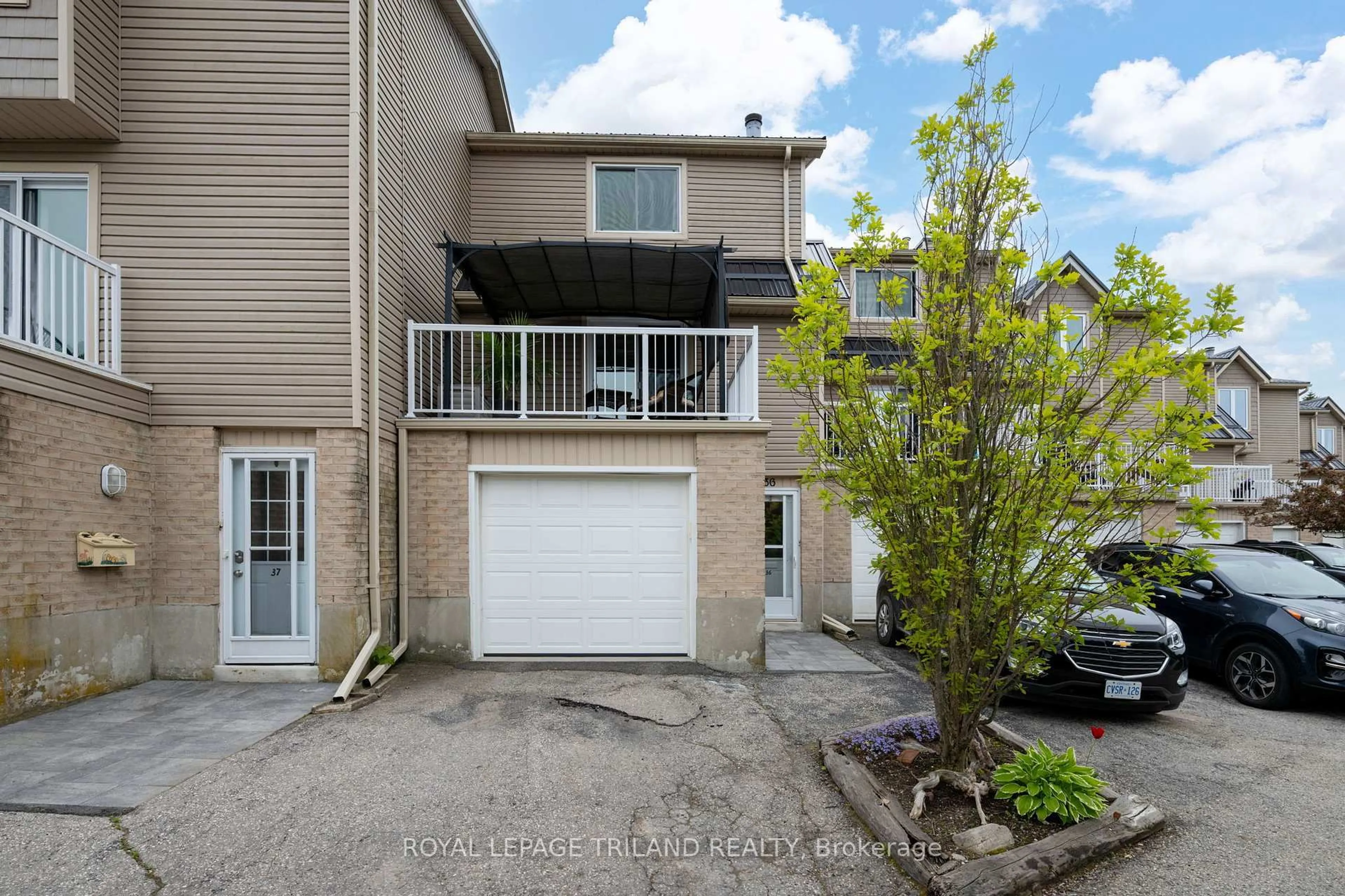 A pic from outside/outdoor area/front of a property/back of a property/a pic from drone, street for 301 Carlow Rd #36, Central Elgin Ontario N5L 1B8
