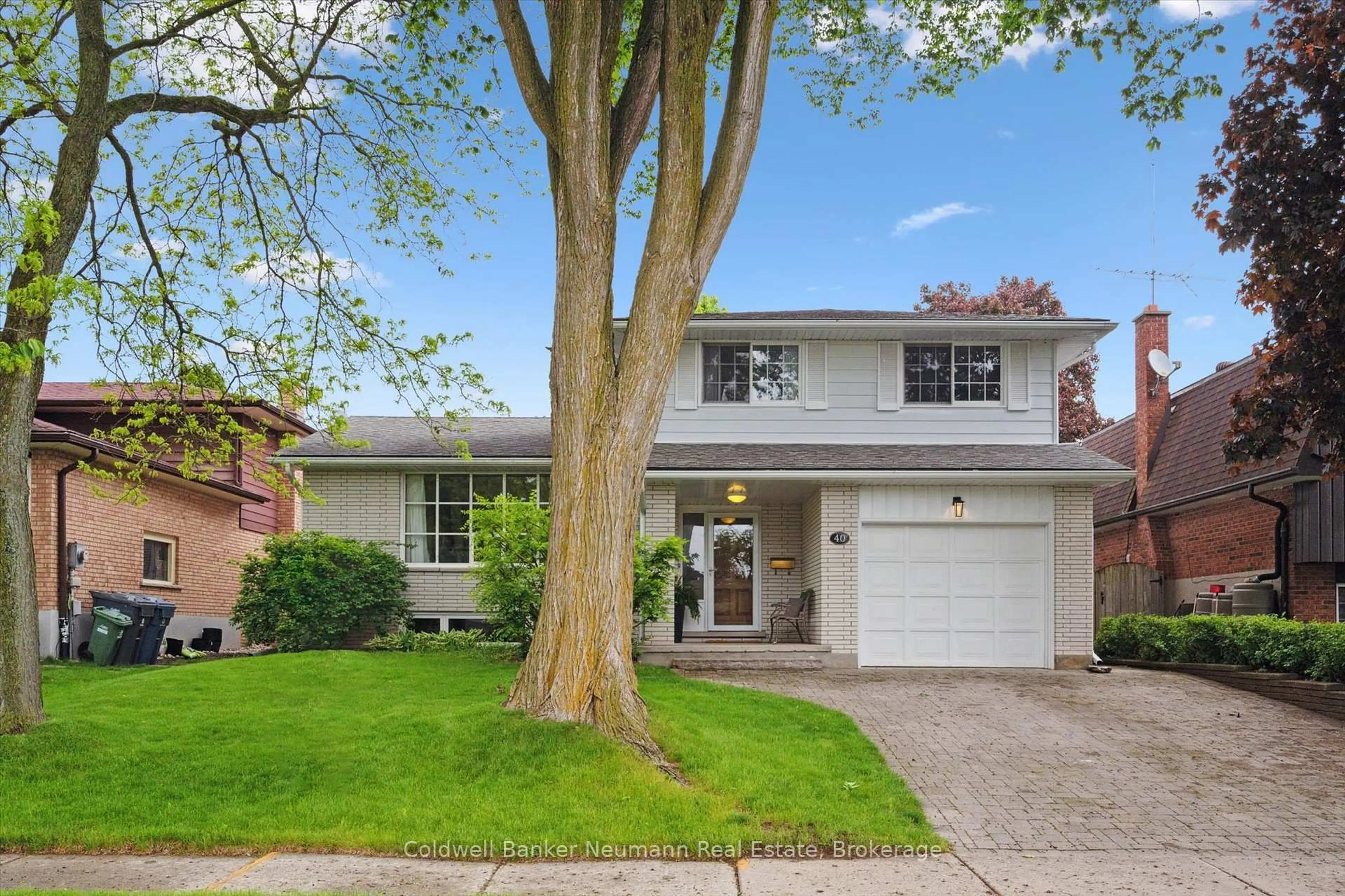 Home with brick exterior material, street for 40 Keats Cres, Guelph Ontario N1G 3B2