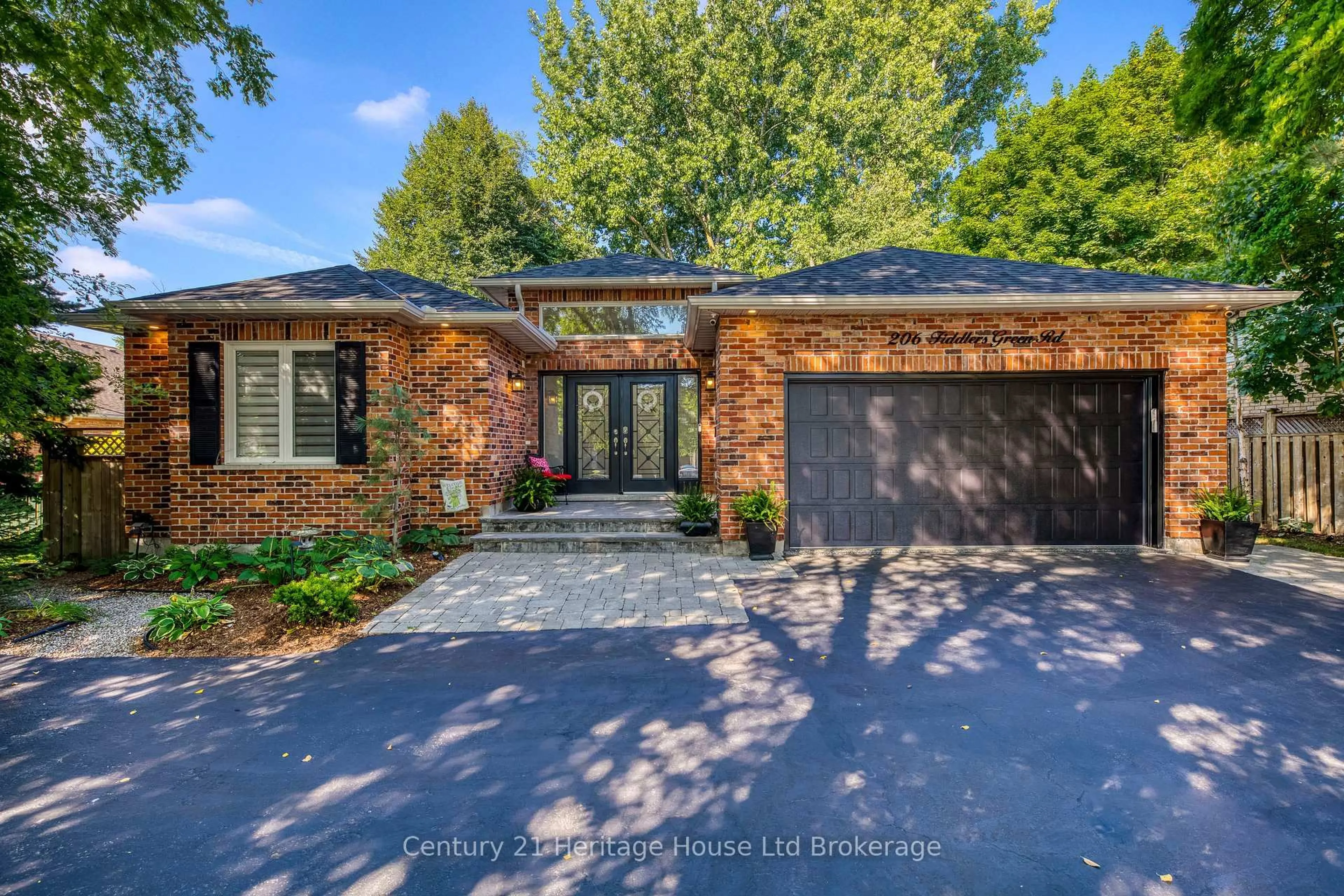 Home with brick exterior material, street for 206 Fiddlers Green Rd, Hamilton Ontario L9G 1W6