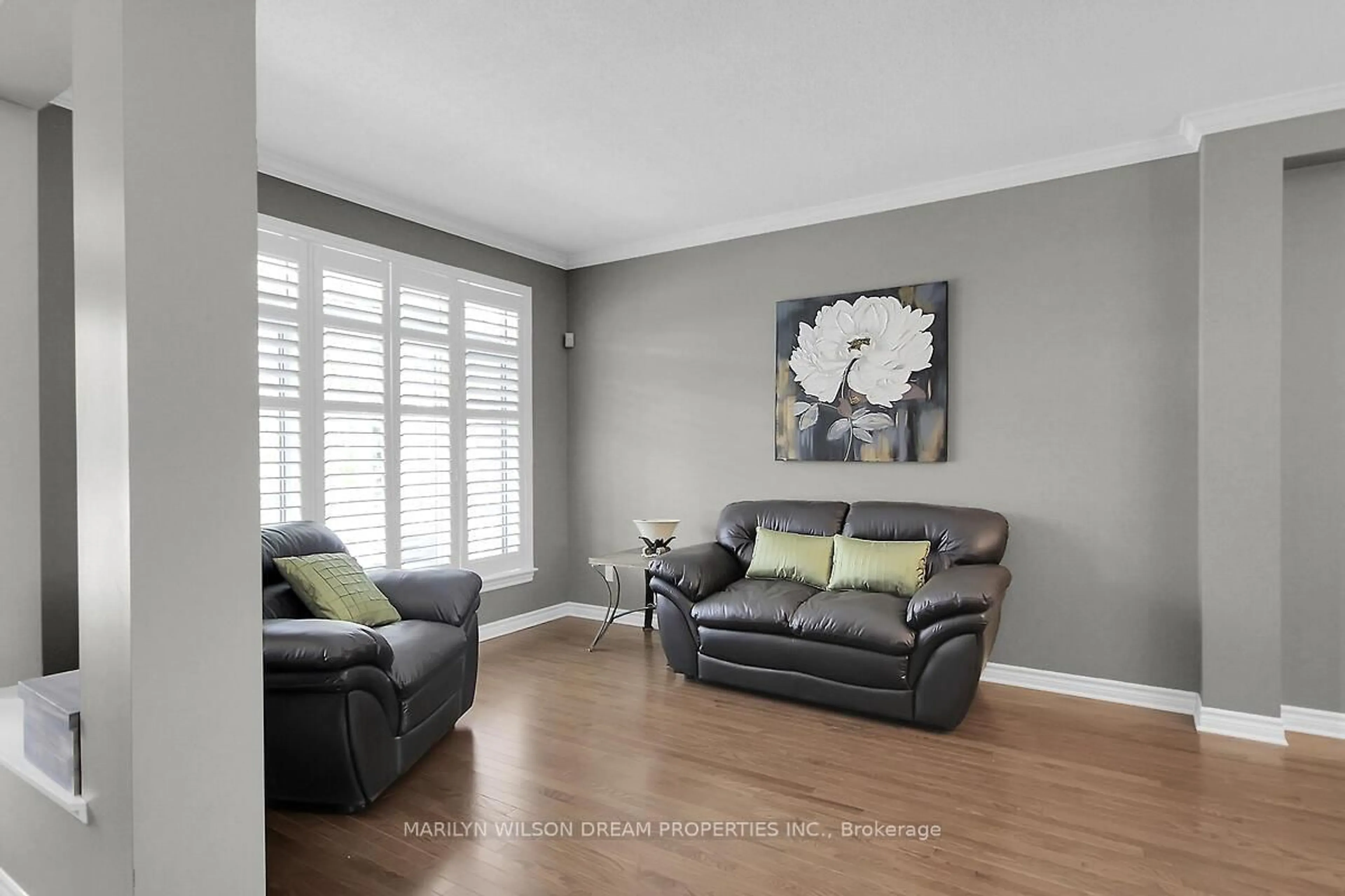 Living room with furniture, wood/laminate floor for 652 Netley Circ, Ottawa Ontario K1T 0A4