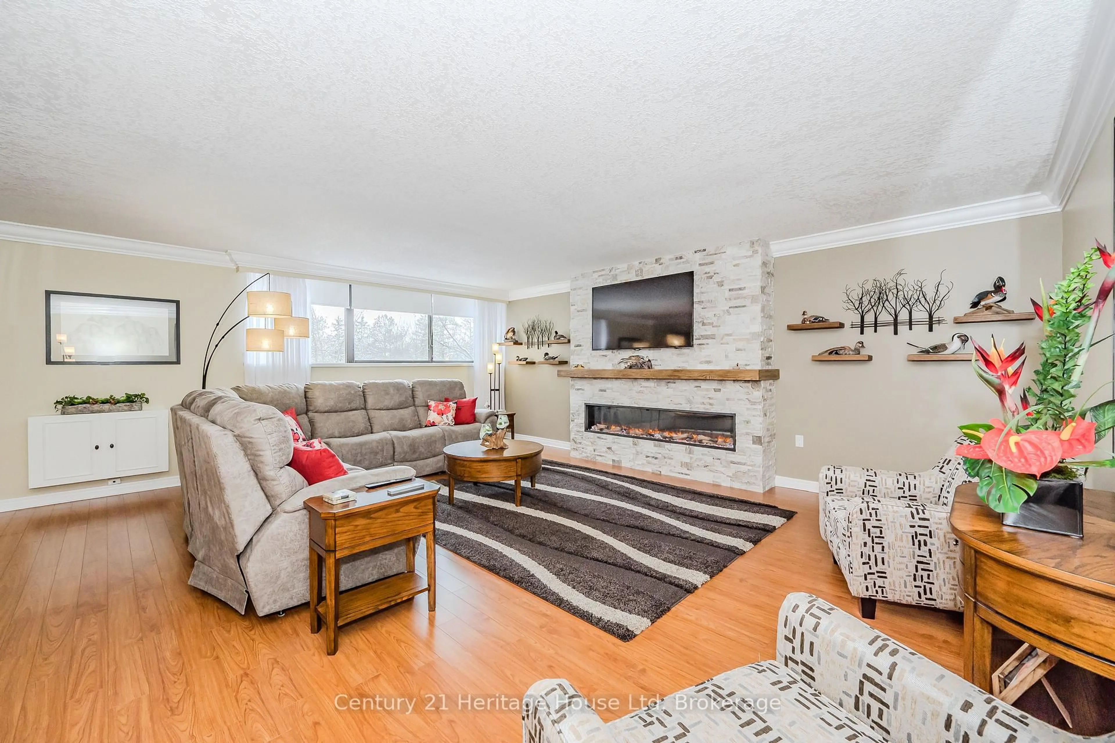 Living room with furniture, unknown for 93 Westwood Rd #306, Guelph Ontario N1H 7J6