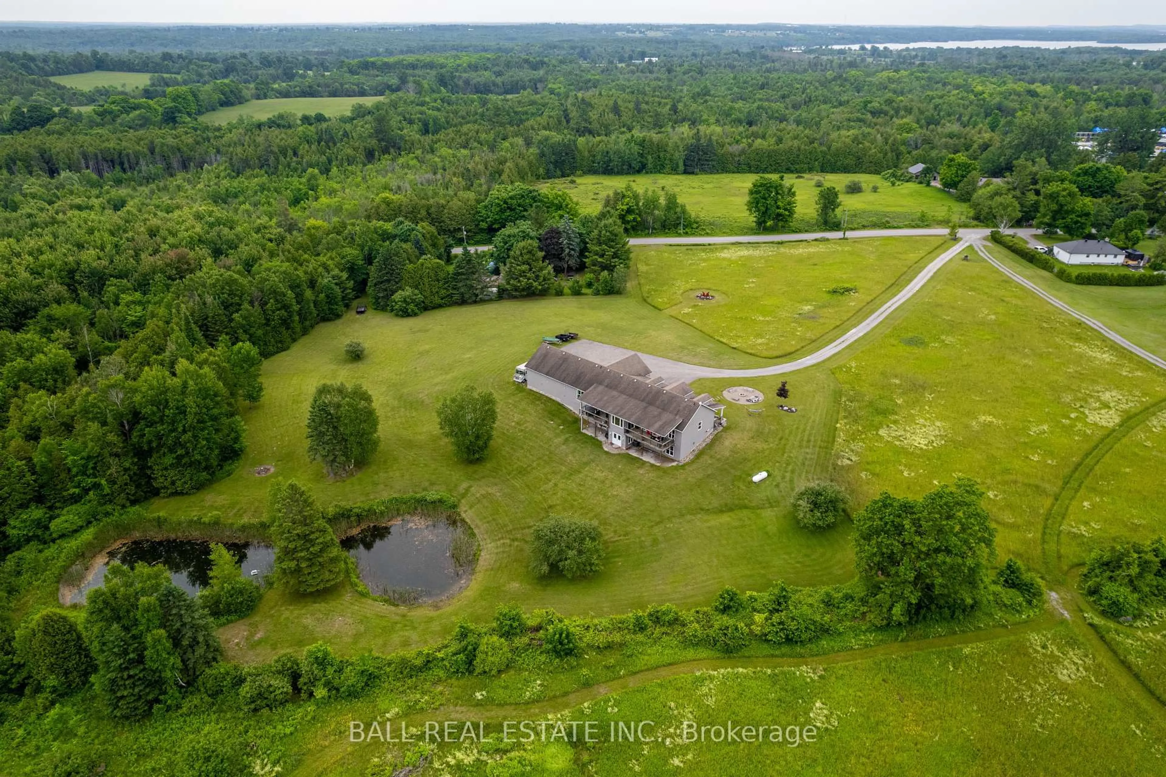 A pic from outside/outdoor area/front of a property/back of a property/a pic from drone, water/lake/river/ocean view for 2120 Deer Bay Rd, Selwyn Ontario K0L 2H0