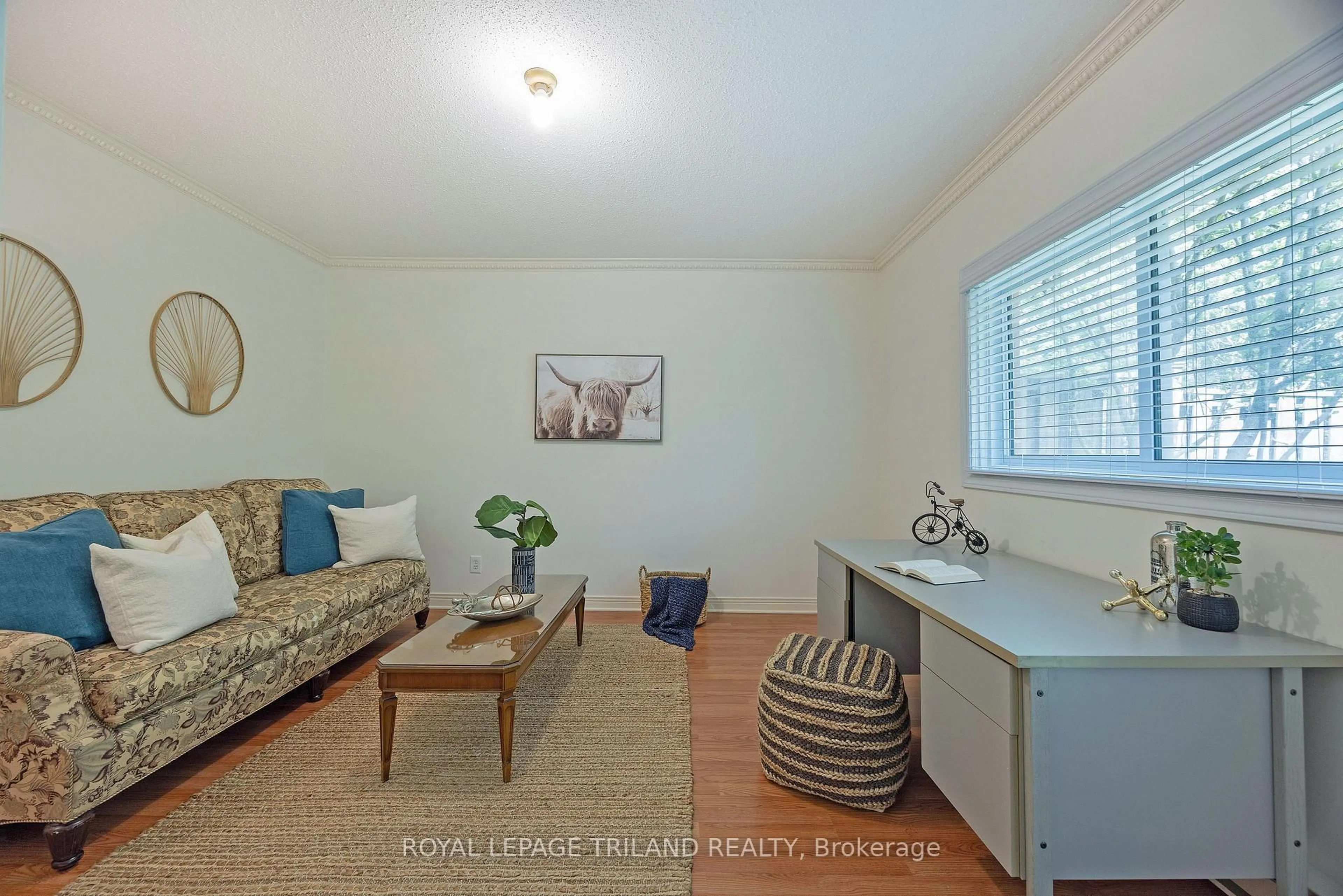 Living room with furniture, wood/laminate floor for 683 Windermere Rd #23, London North Ontario N5X 3T9
