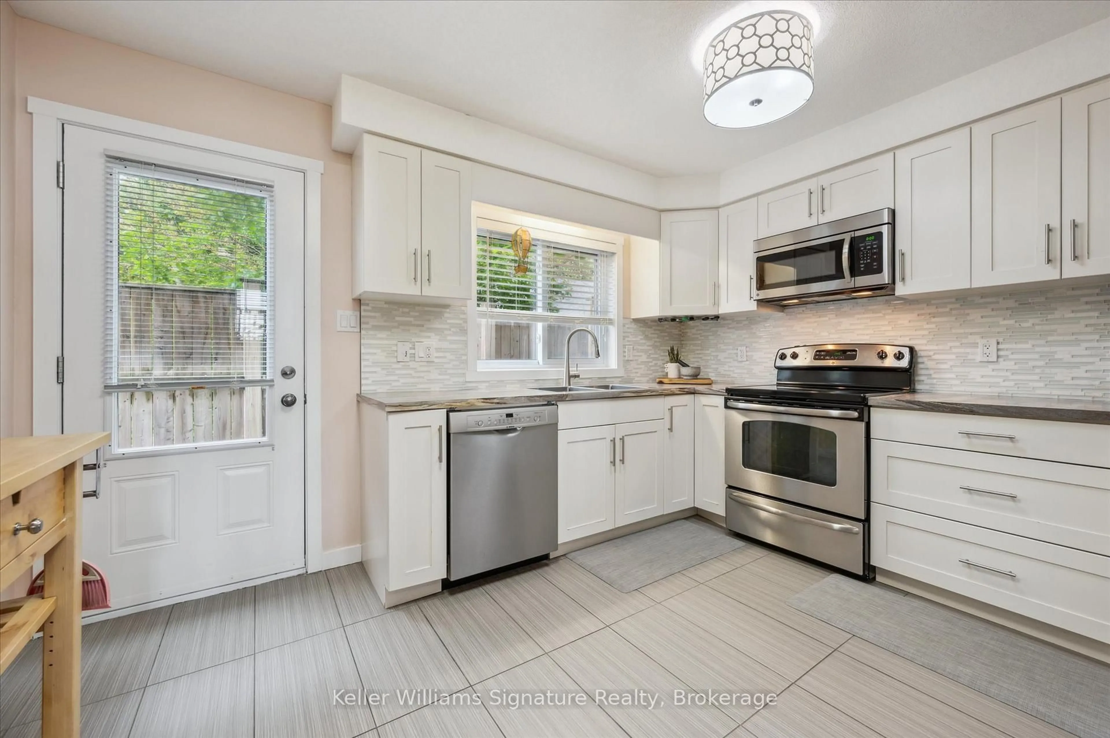 Open concept kitchen, ceramic/tile floor for 487 East Ave #2, Kitchener Ontario N2H 0A8