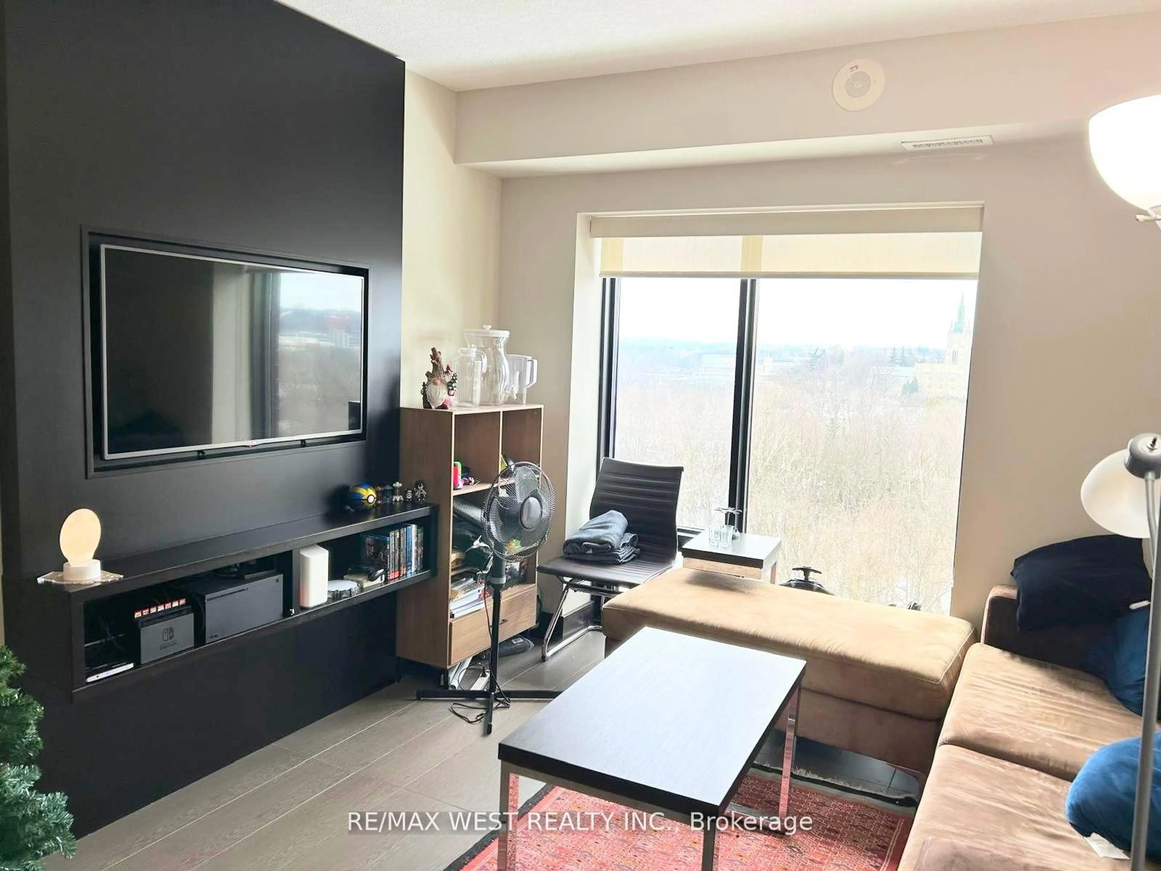Living room with furniture, wood/laminate floor for 1235 Richmond St #1313, London East Ontario N6A 0C1