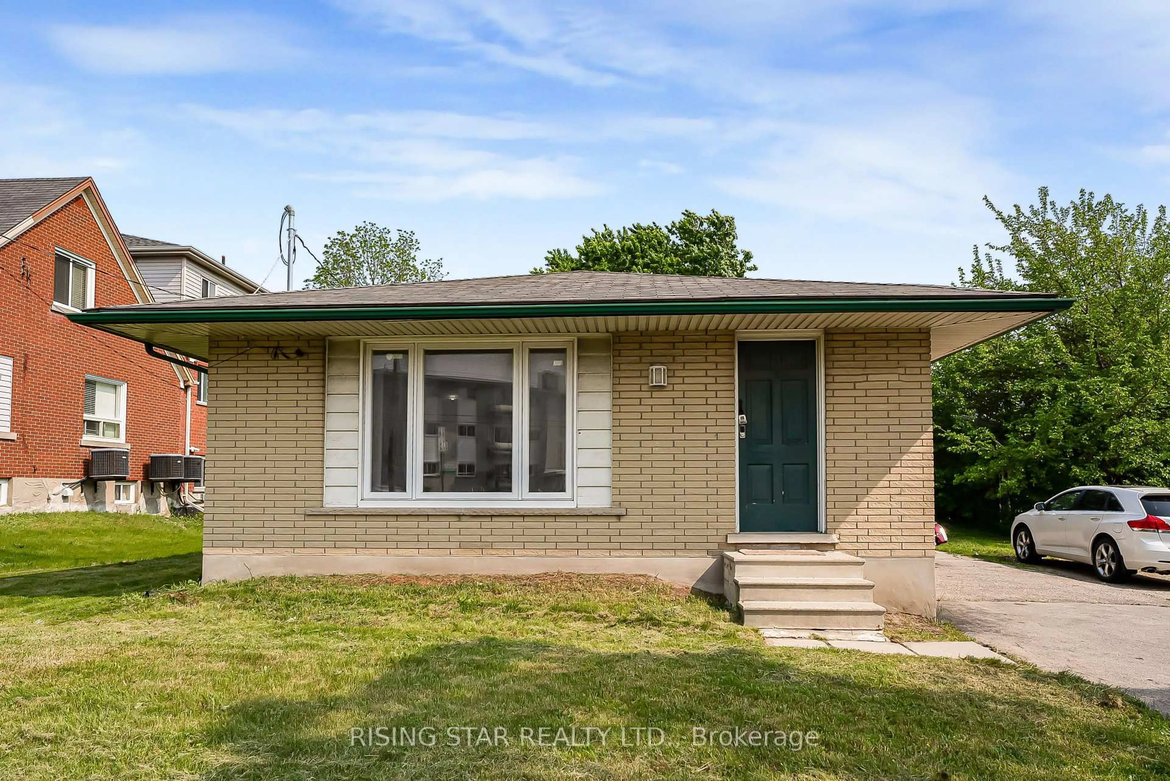 Home with brick exterior material, street for 147 University Ave, Waterloo Ontario N2J 2W4