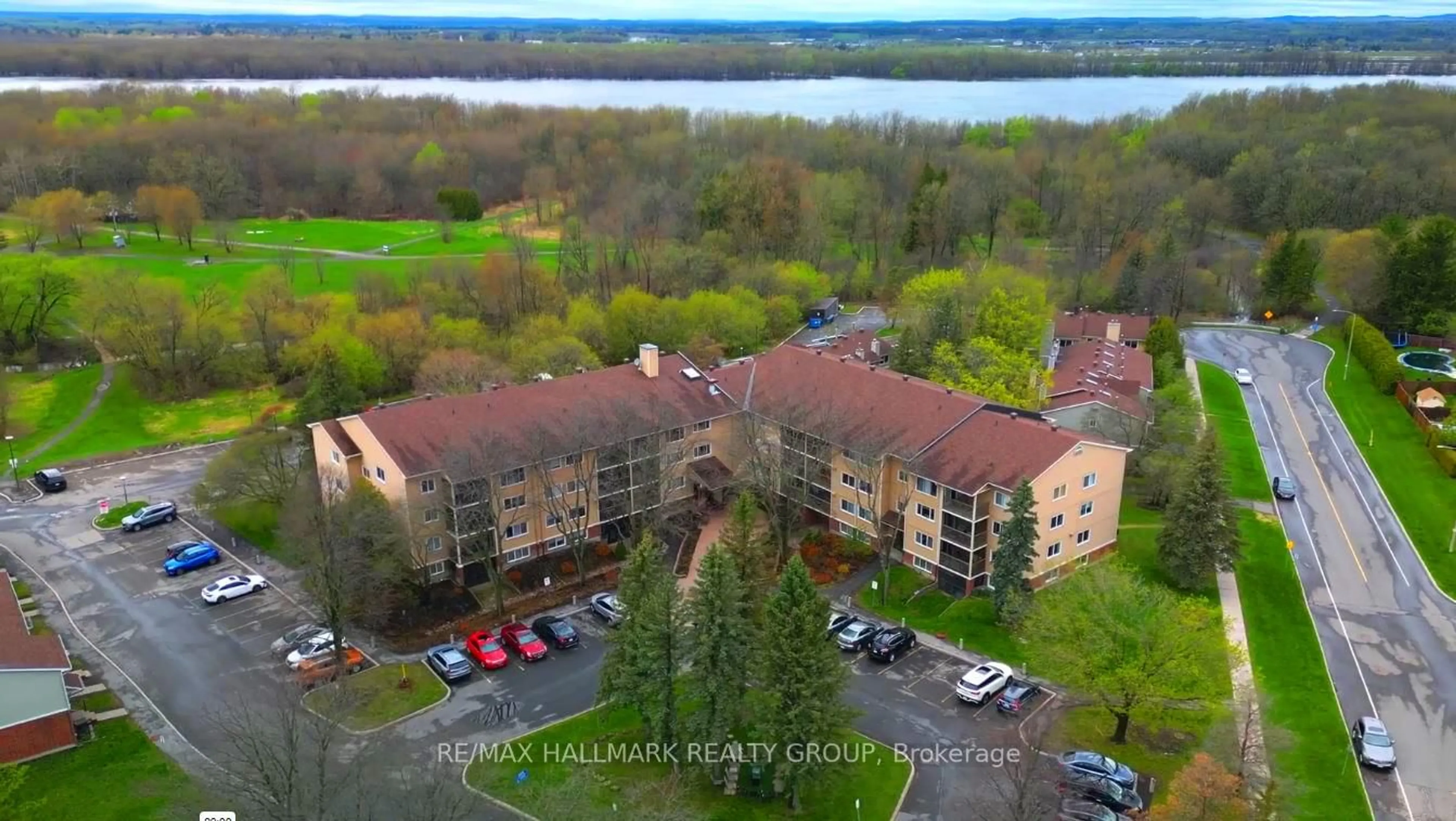 A pic from outside/outdoor area/front of a property/back of a property/a pic from drone, water/lake/river/ocean view for 6376 Bilberry Dr #215, Ottawa Ontario K1C 4P6