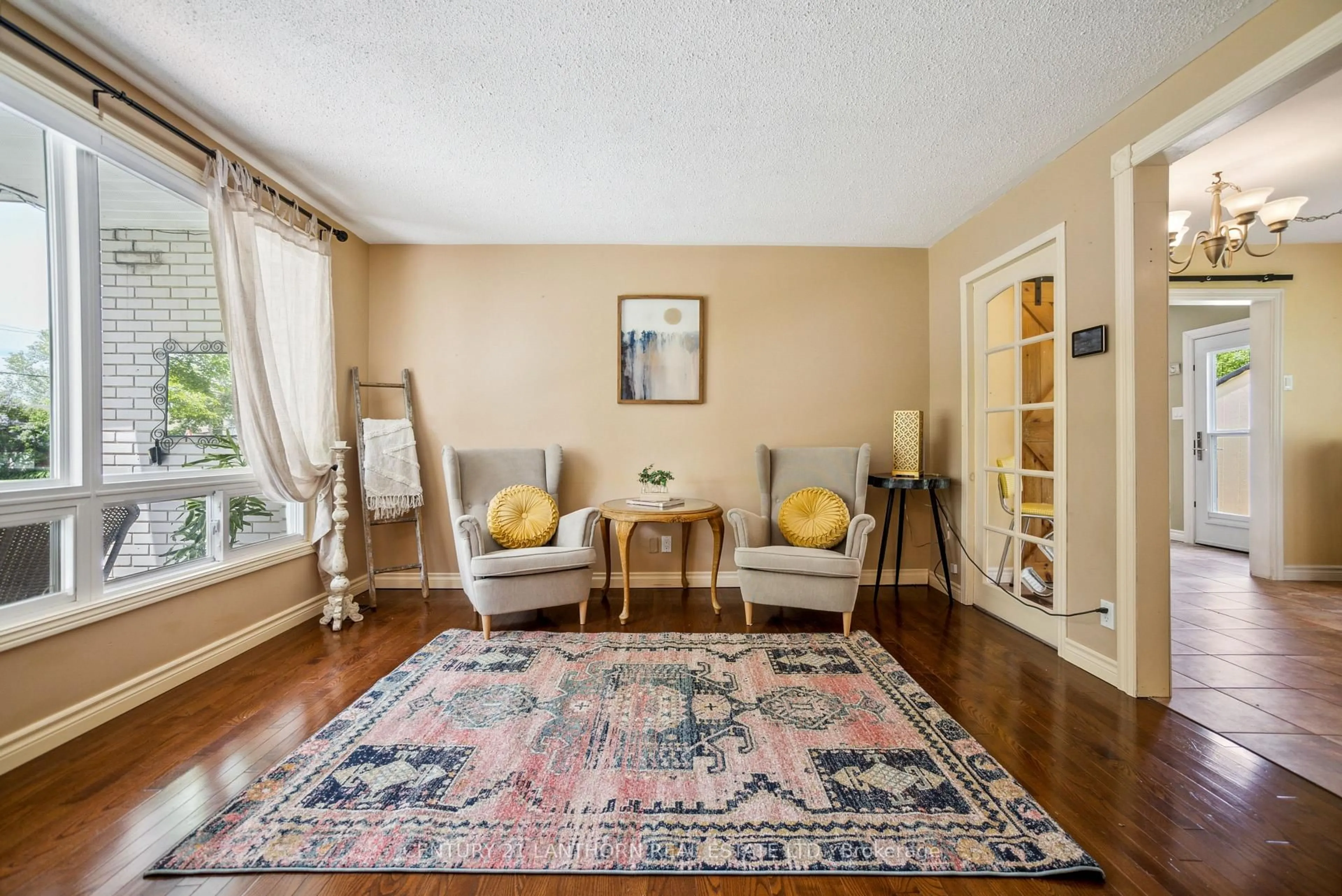 Living room with furniture, carpet floor for 24 Consecon Main St, Prince Edward County Ontario K0K 1T0