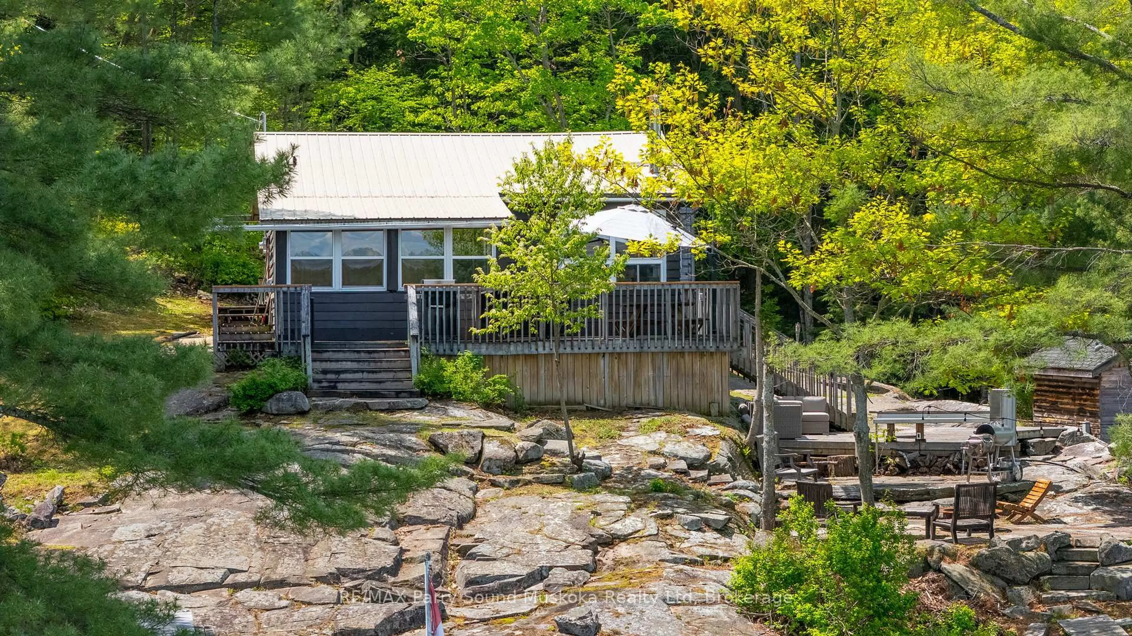 A pic from outside/outdoor area/front of a property/back of a property/a pic from drone, water/lake/river/ocean view for 7 Isabella Island, The Archipelago Ontario P2A 2W8