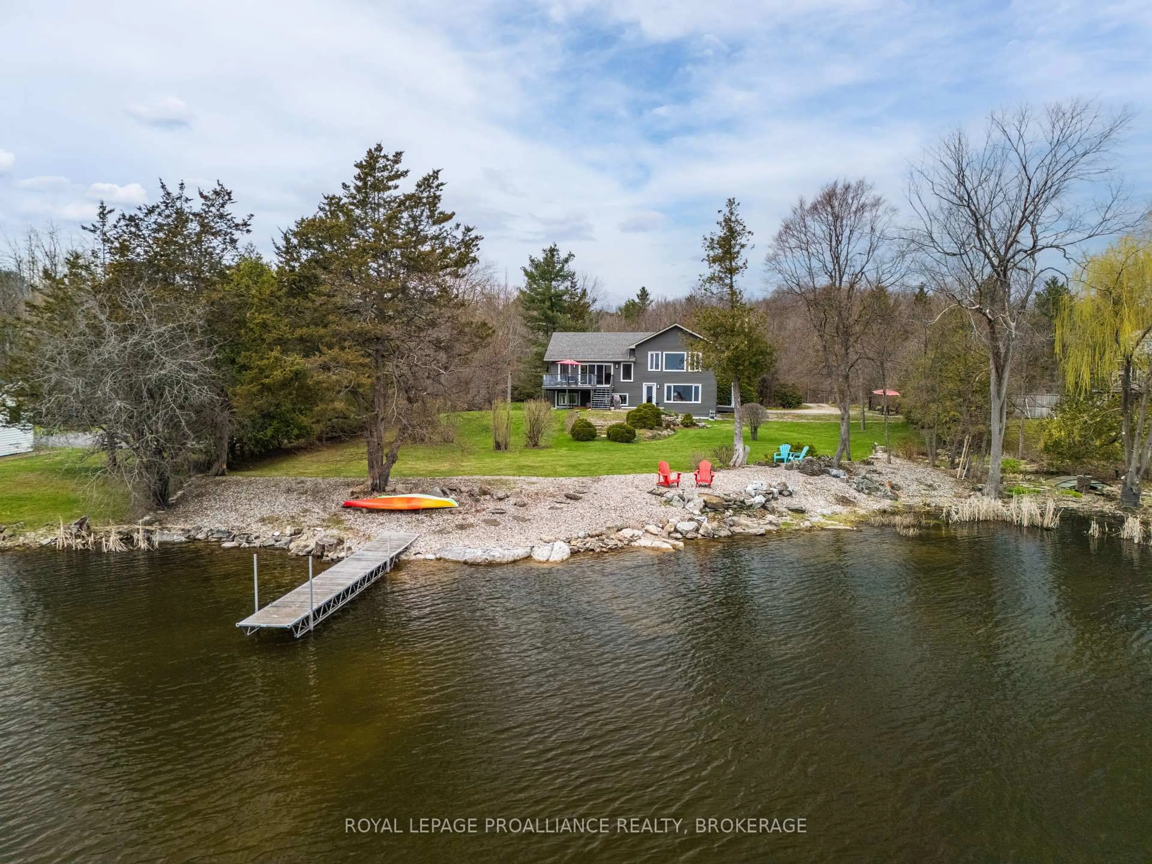A pic from outside/outdoor area/front of a property/back of a property/a pic from drone, water/lake/river/ocean view for 2749 Lakefield Dr, Inverary Ontario K0H 1X0