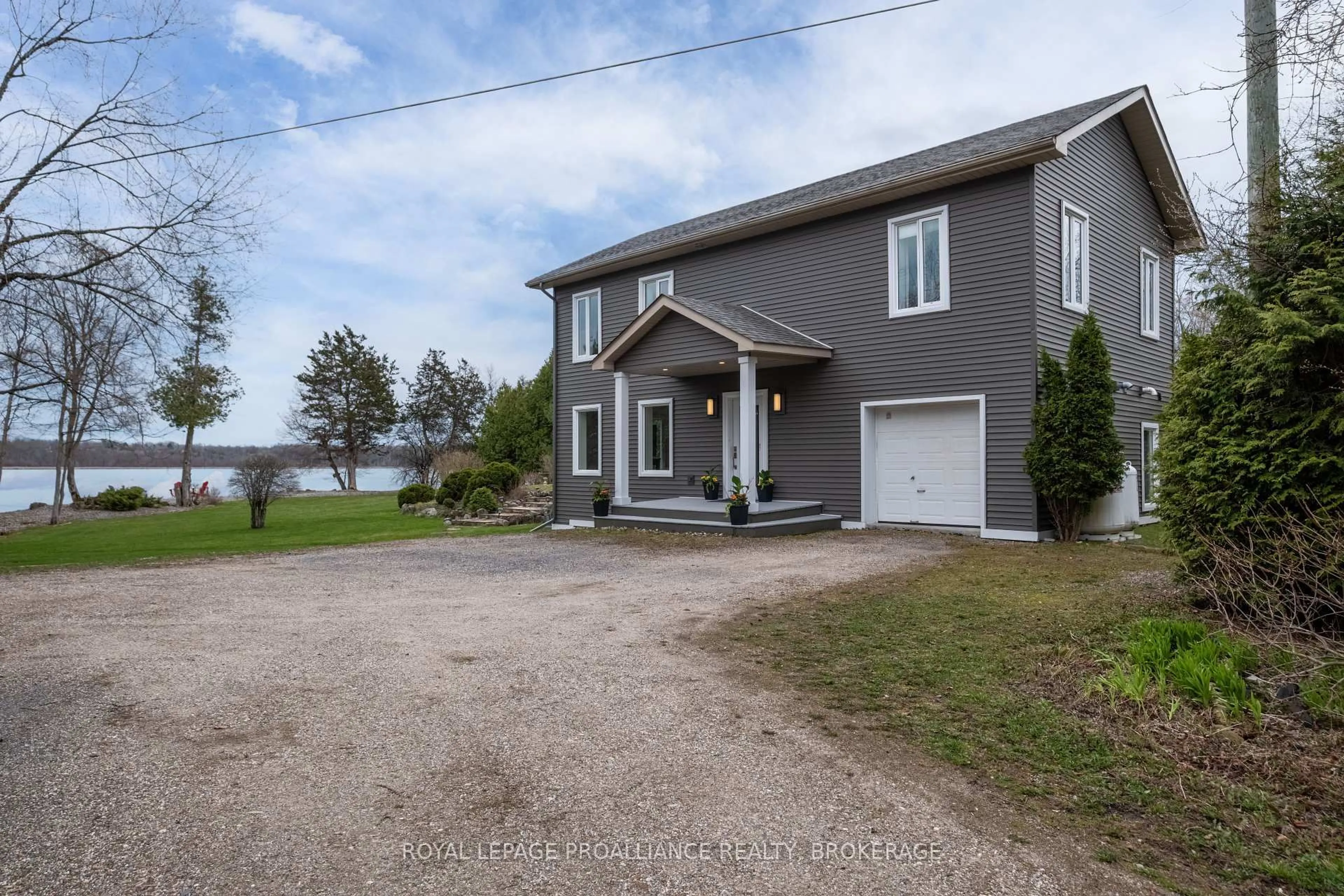 A pic from outside/outdoor area/front of a property/back of a property/a pic from drone, water/lake/river/ocean view for 2749 Lakefield Dr, Inverary Ontario K0H 1X0