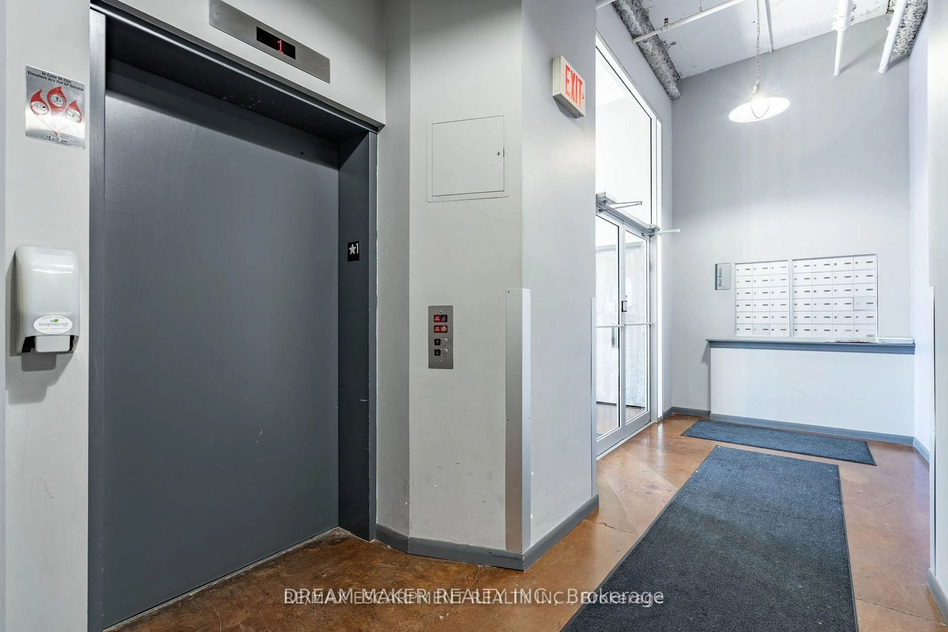 Indoor foyer for 11 Rebecca St #102, Hamilton Ontario L8R 3H7