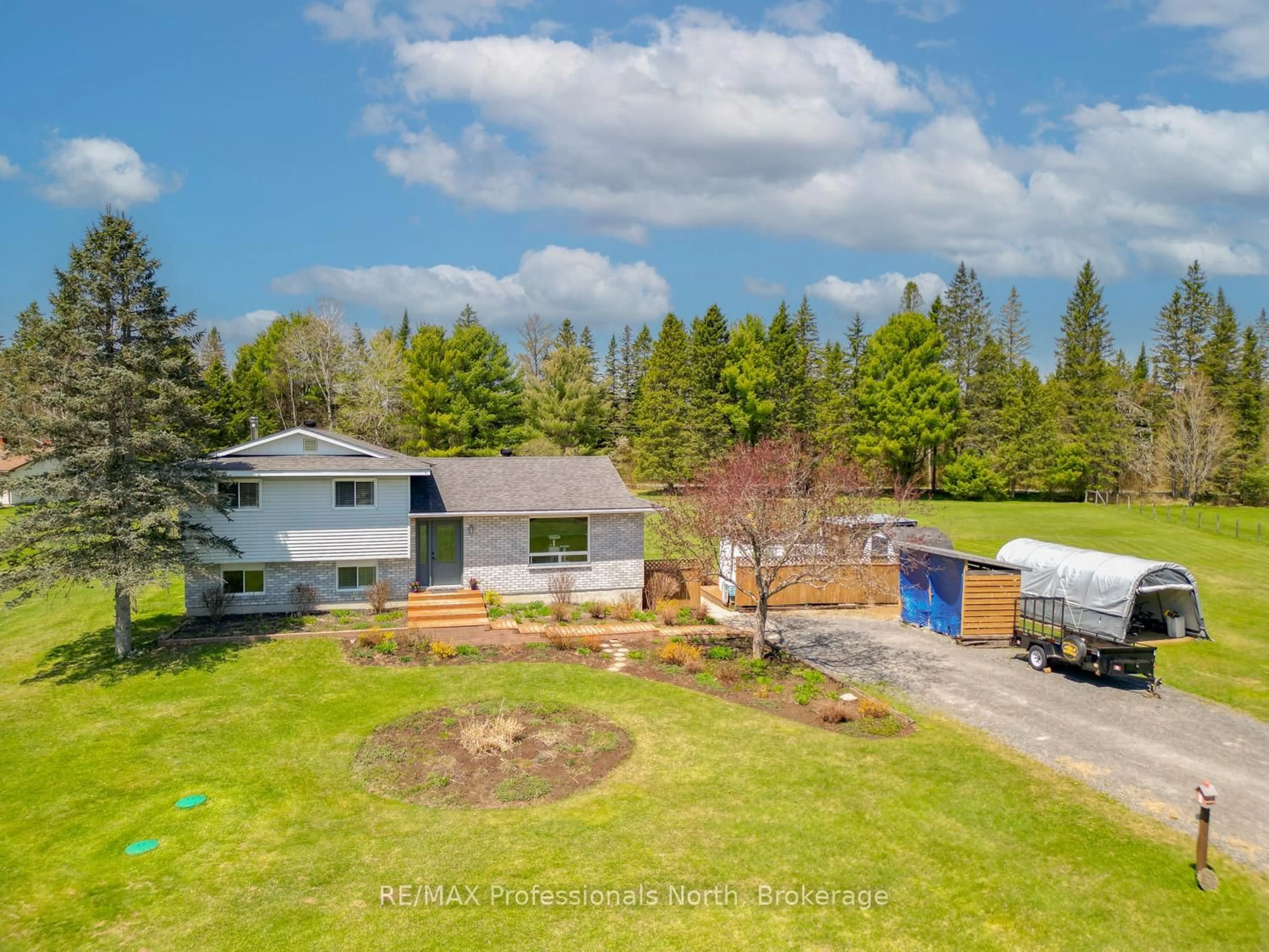 A pic from outside/outdoor area/front of a property/back of a property/a pic from drone, water/lake/river/ocean view for 1400 Old Muskoka Rd, Huntsville Ontario P0B 1M0