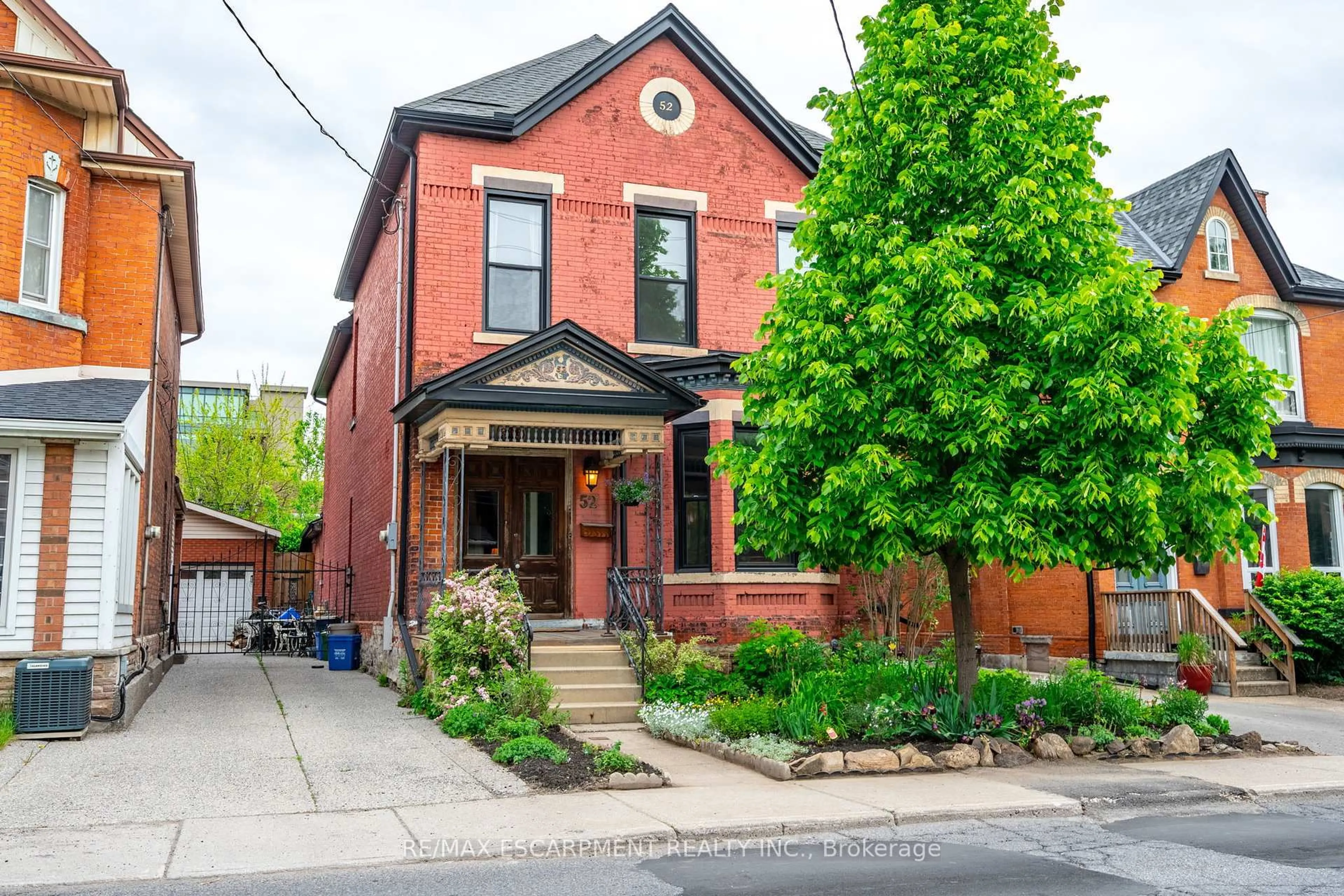 Home with brick exterior material, street for 52 Barton St, Hamilton Ontario L8L 1A4