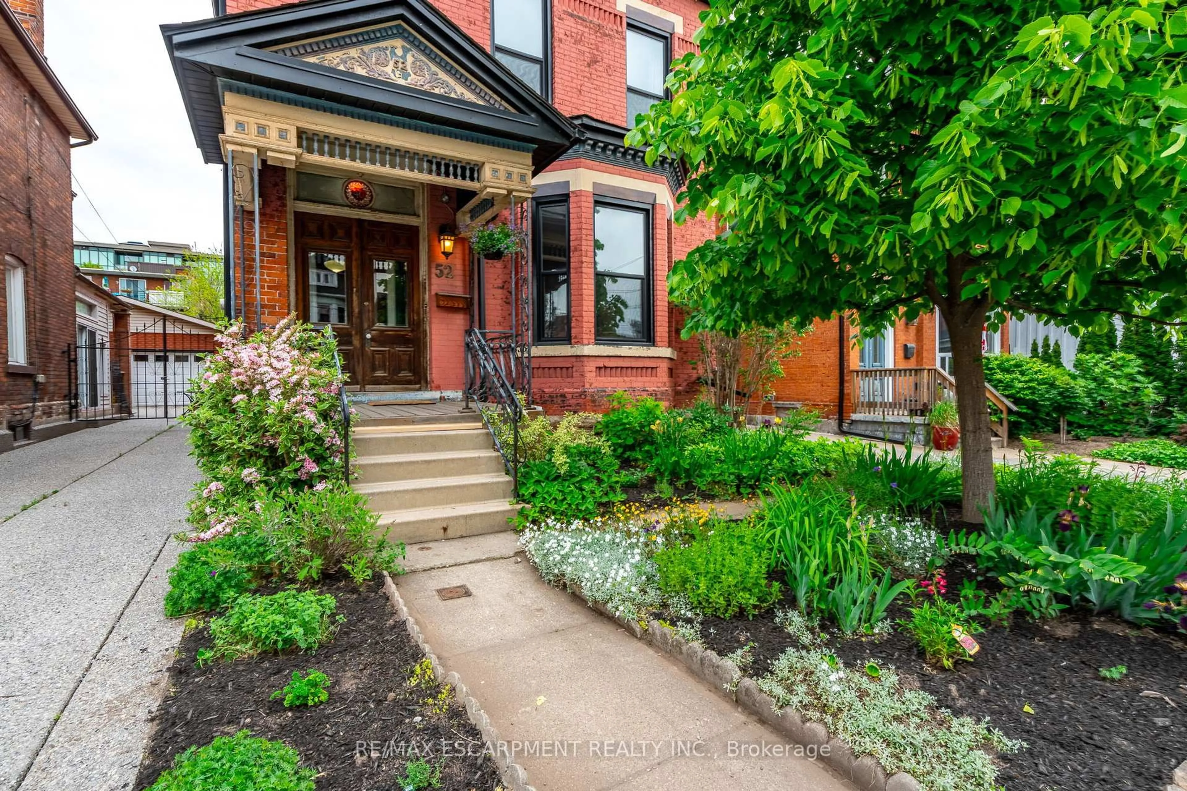 Home with brick exterior material, street for 52 Barton St, Hamilton Ontario L8L 1A4