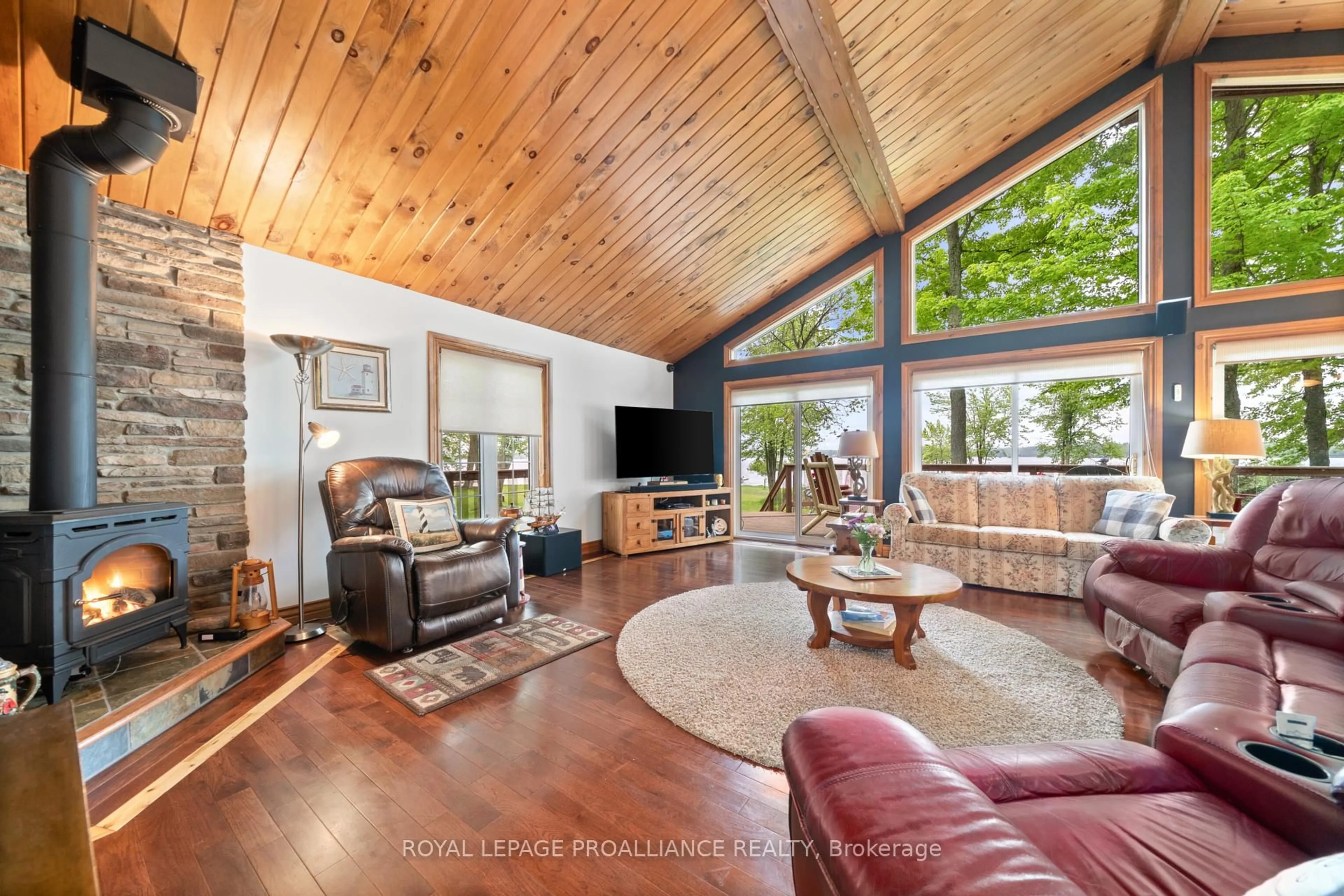 Living room with furniture, wood/laminate floor for 919 Cook Rd, Limoges Ontario K0K 2M0