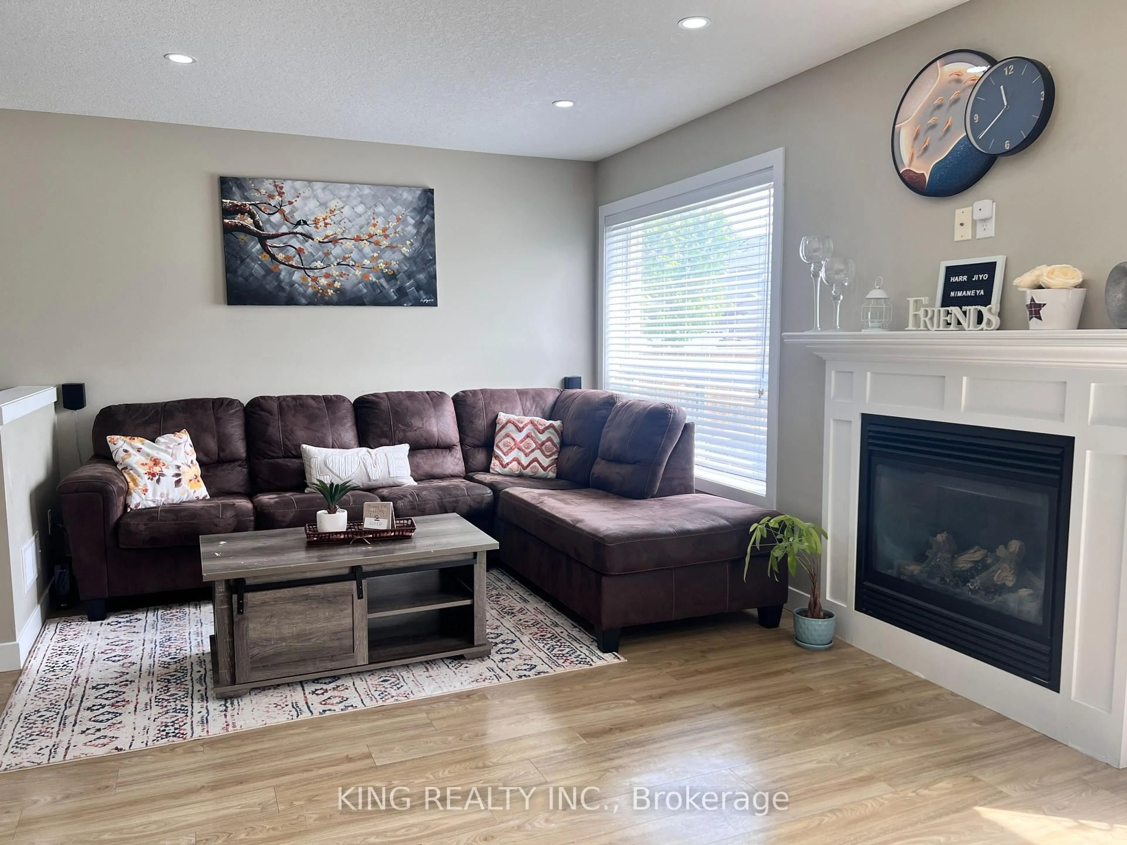 Living room with furniture, wood/laminate floor for 1138 SANDBAR St, London North Ontario N6G 0G6