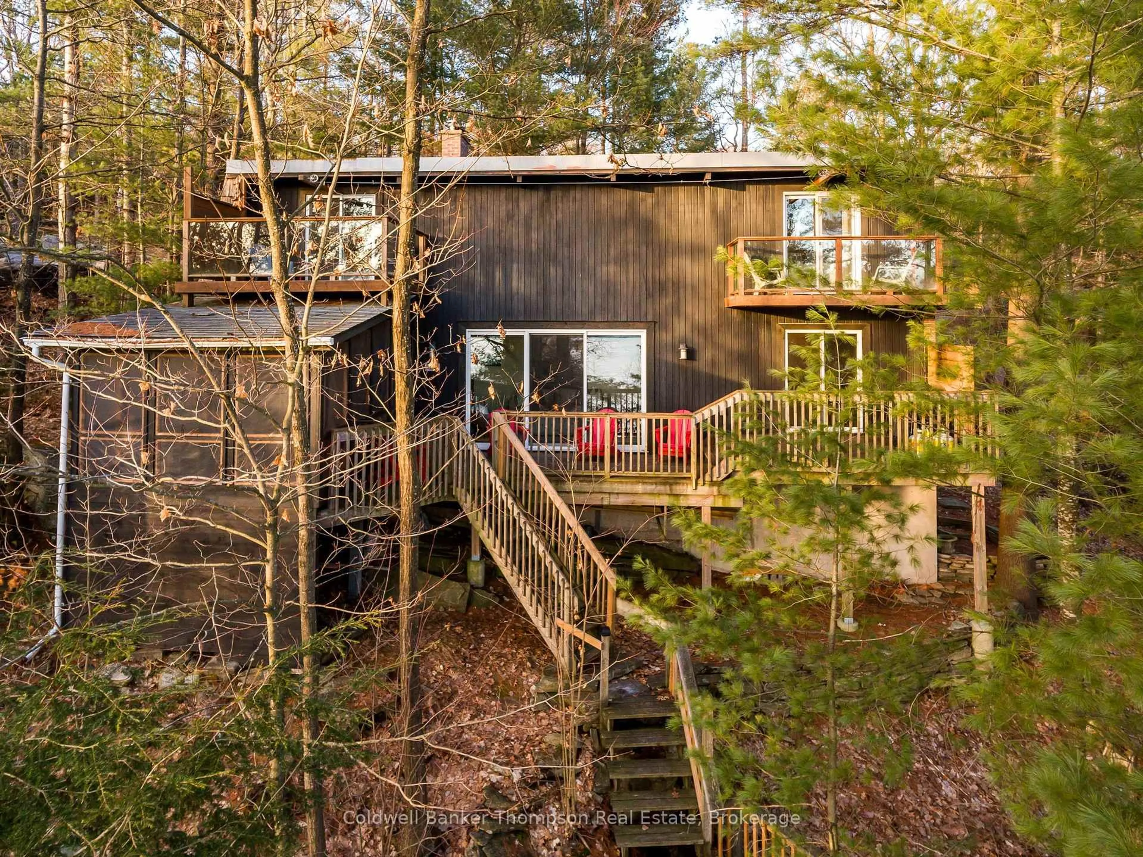 A pic from outside/outdoor area/front of a property/back of a property/a pic from drone, forest/trees view for 148 GOLDEN PHEASANT Dr, Huntsville Ontario P1H 1B3