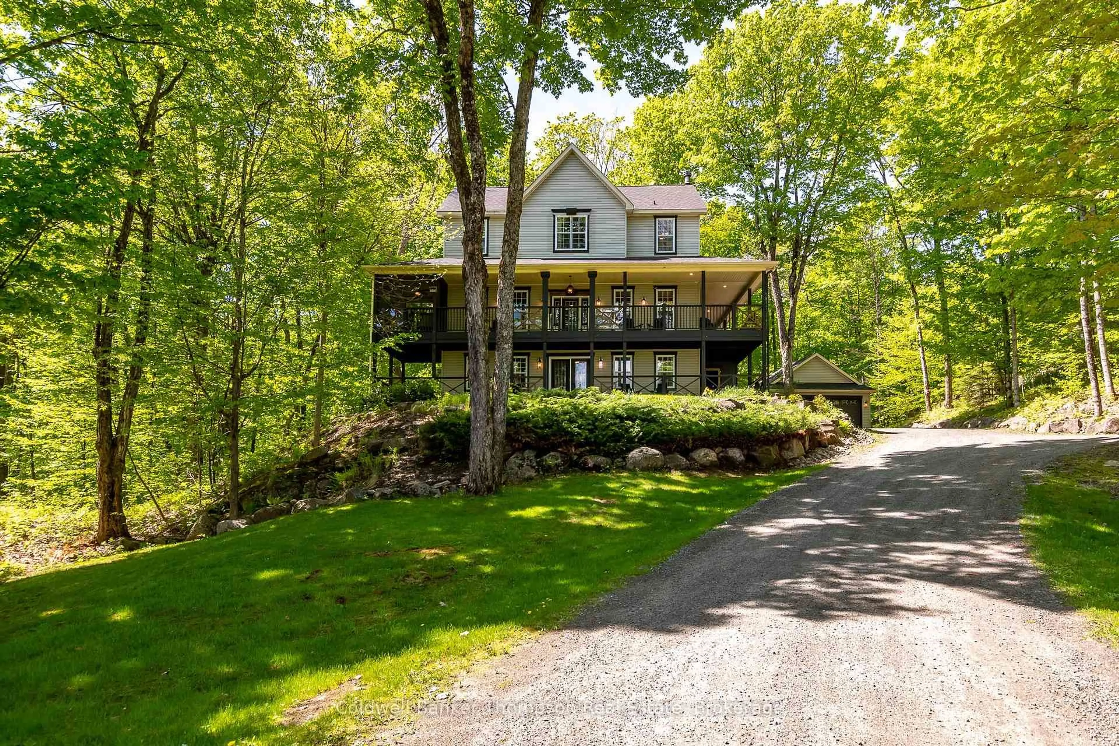 A pic from outside/outdoor area/front of a property/back of a property/a pic from drone, unknown for 39 Deerfoot Tr, Huntsville Ontario P1H 0A6
