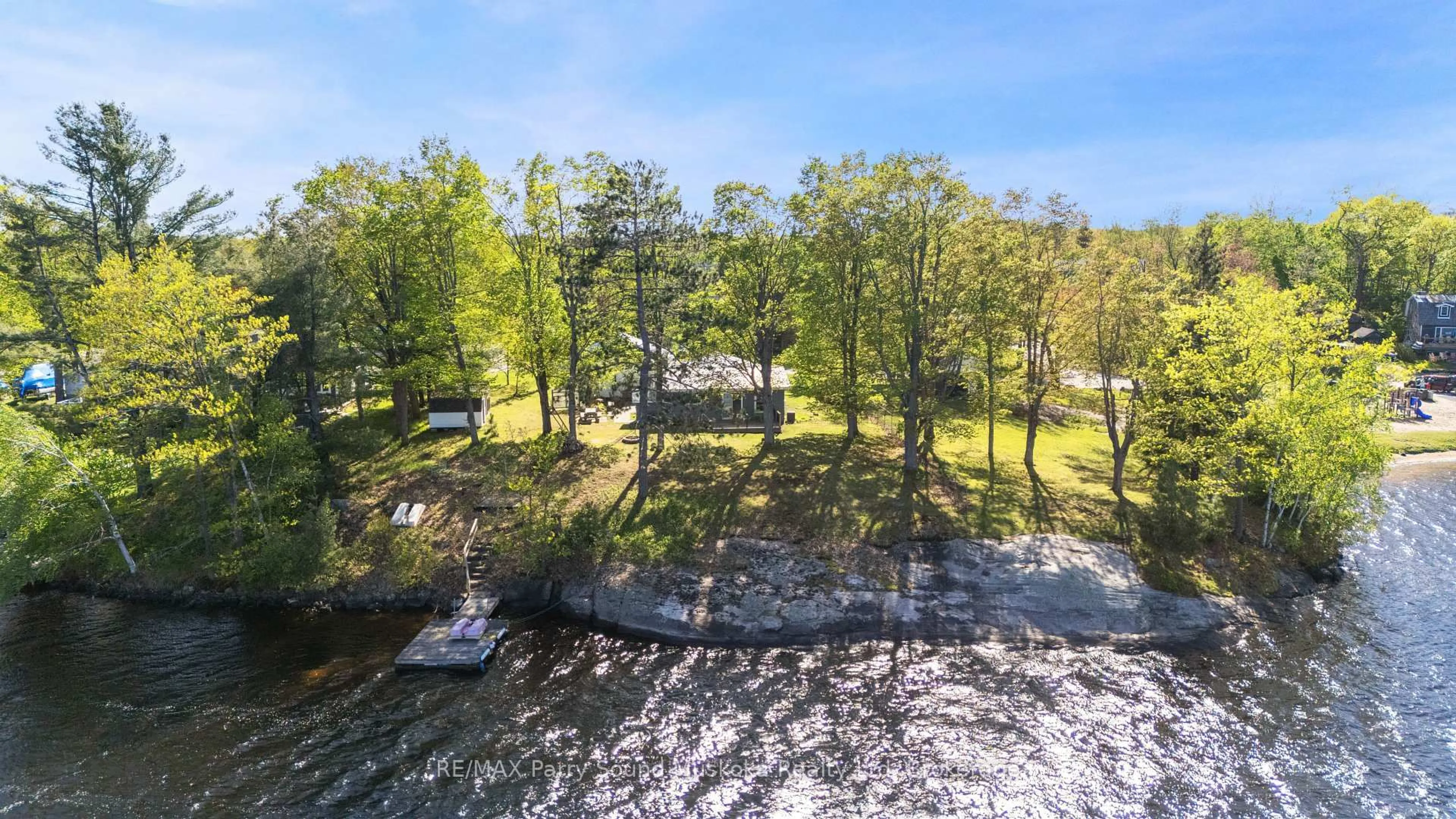 A pic from outside/outdoor area/front of a property/back of a property/a pic from drone, water/lake/river/ocean view for 61 Stewart St, Georgian Bay Ontario P0C 1H0