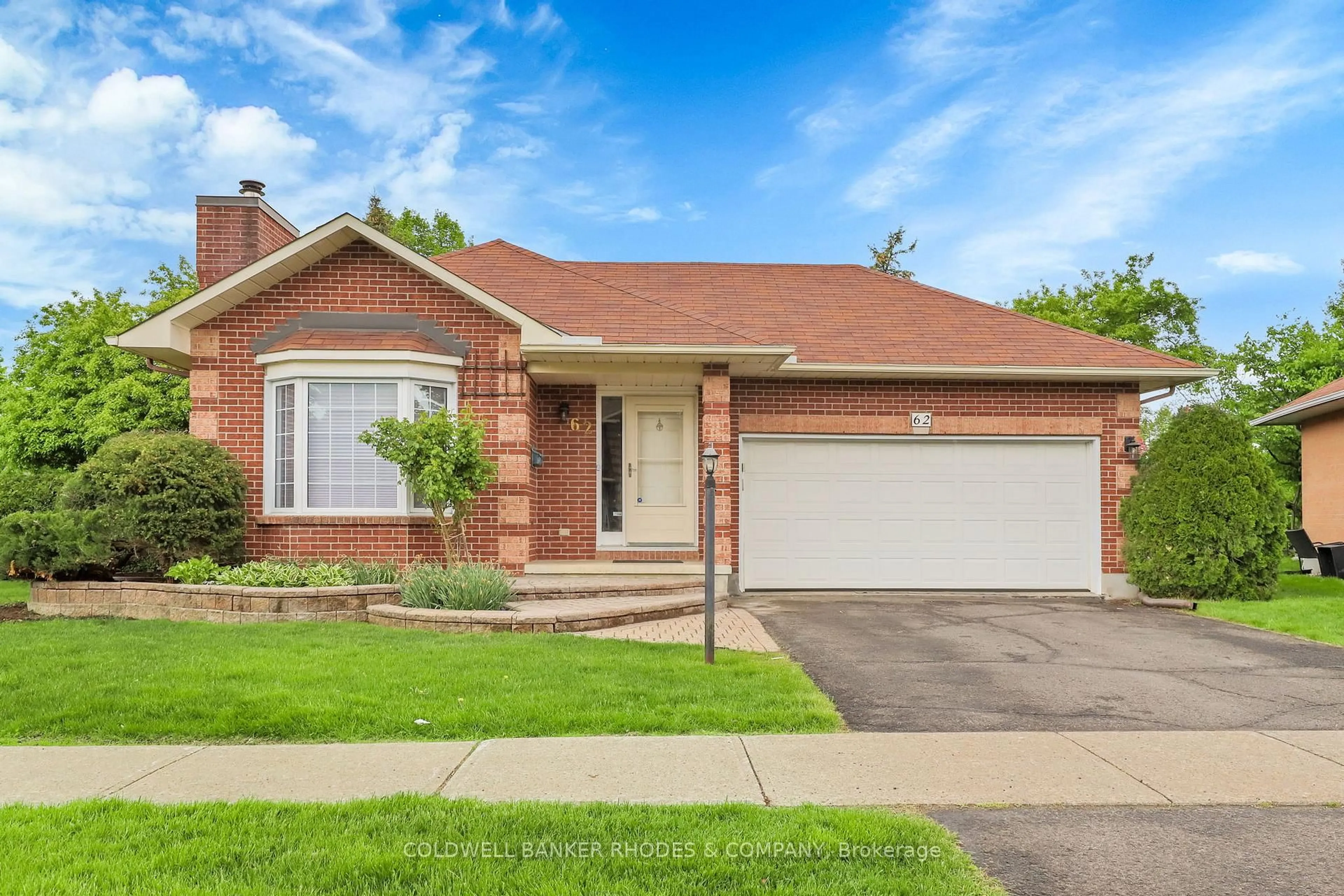 Home with brick exterior material, street for 62 Beechfern Dr, Stittsville Ontario K2S 1E3