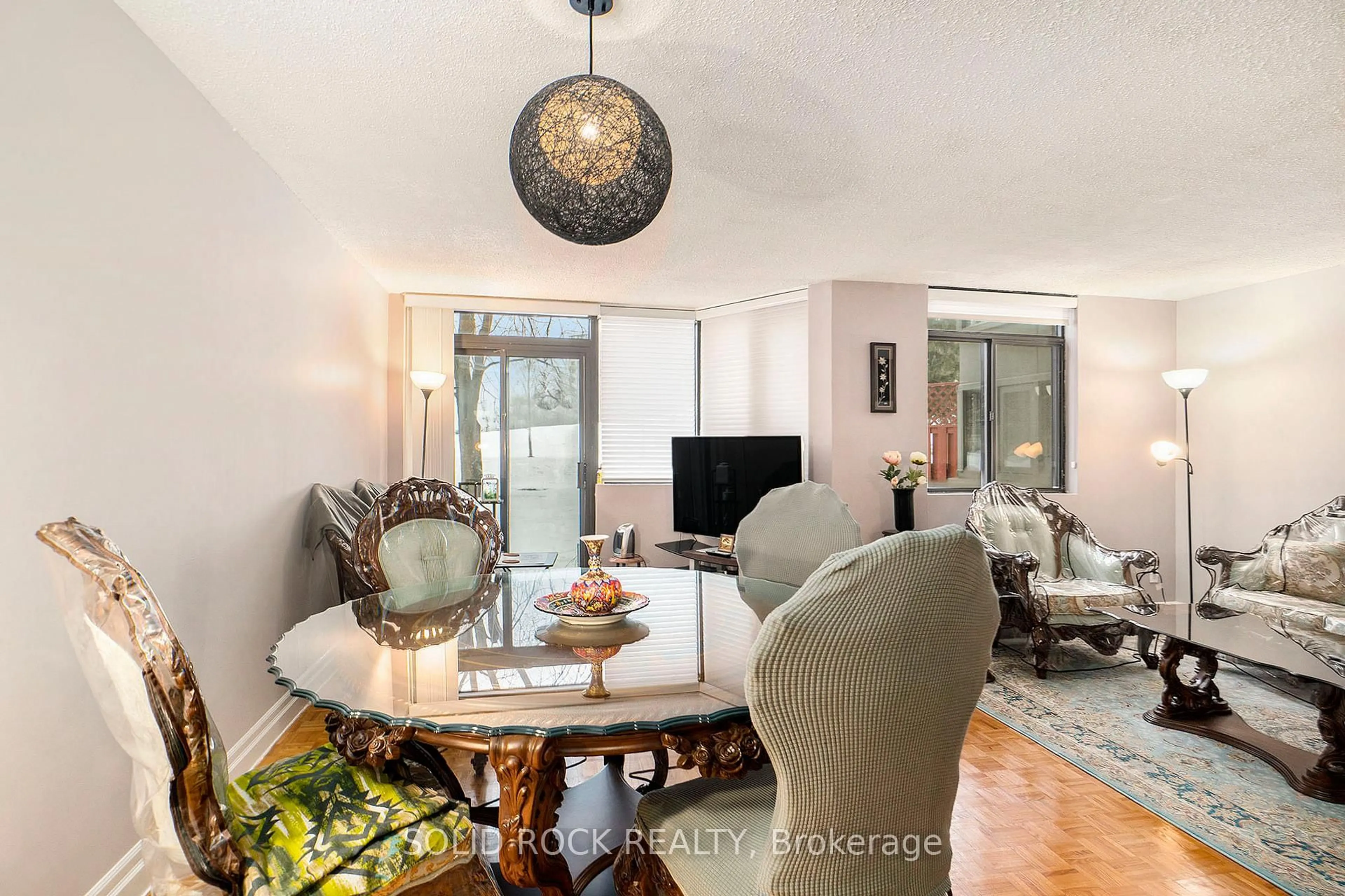 Living room with furniture, wood/laminate floor for 2871 Richmond Rd #108, Ottawa Ontario K2B 8M5