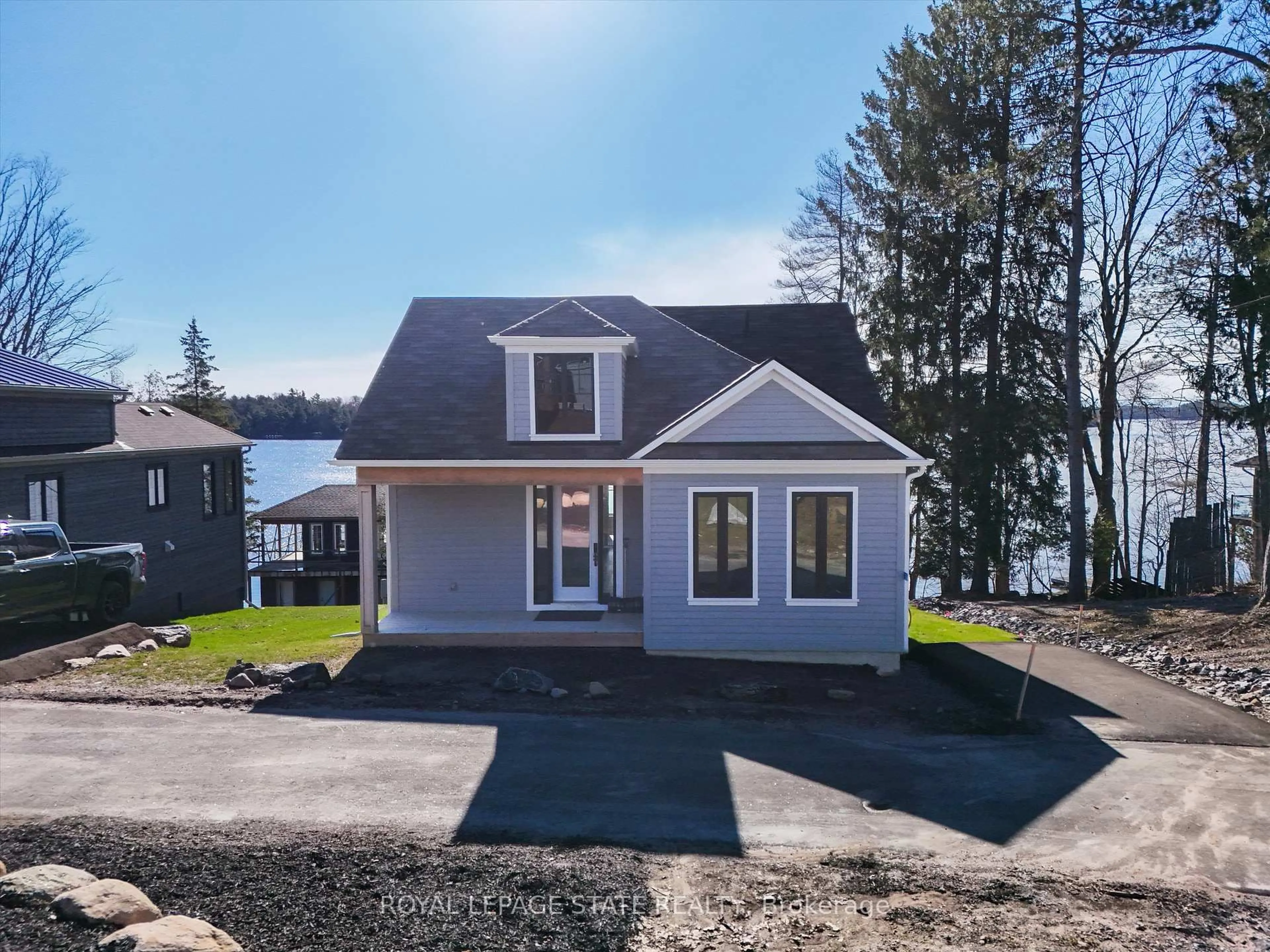 Home with vinyl exterior material, water/lake/river/ocean view for 2054 Peninsula Rd #53, Muskoka Lakes Ontario P0B 1G0