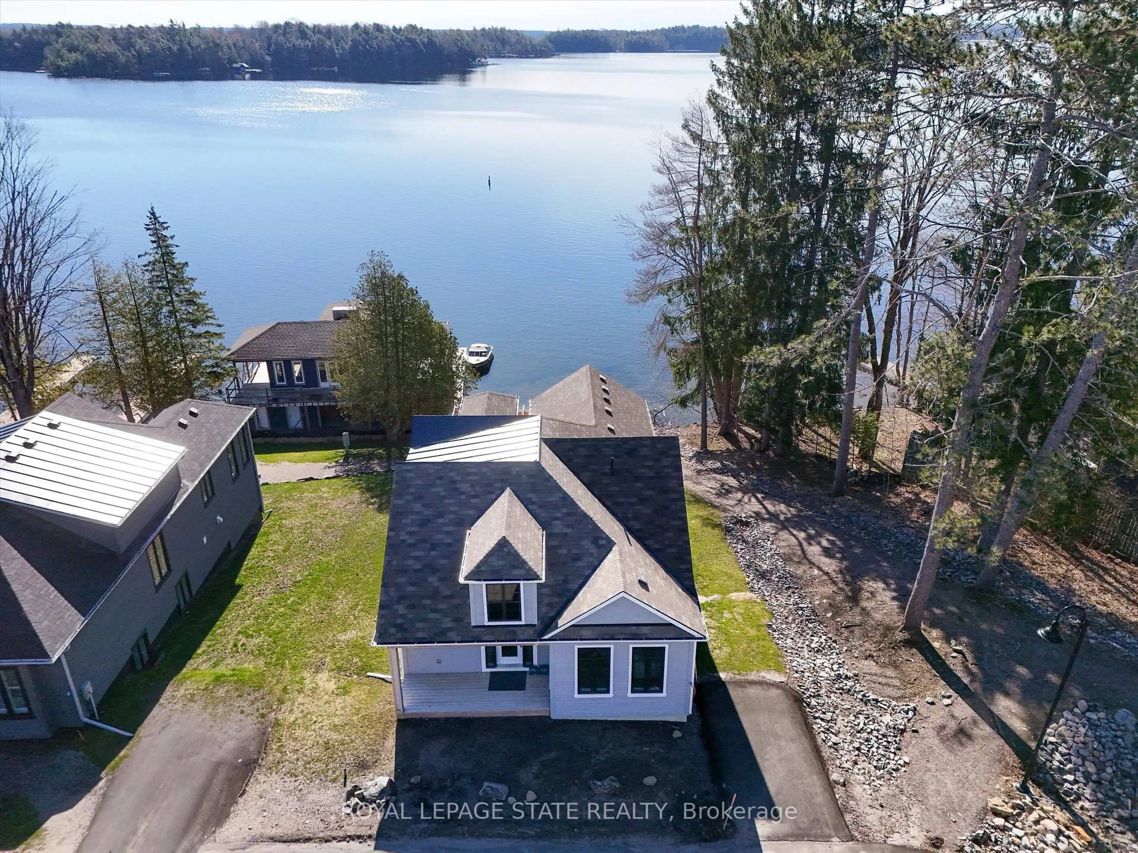 A pic from outside/outdoor area/front of a property/back of a property/a pic from drone, water/lake/river/ocean view for 2054 Peninsula Rd #53, Muskoka Lakes Ontario P0B 1G0