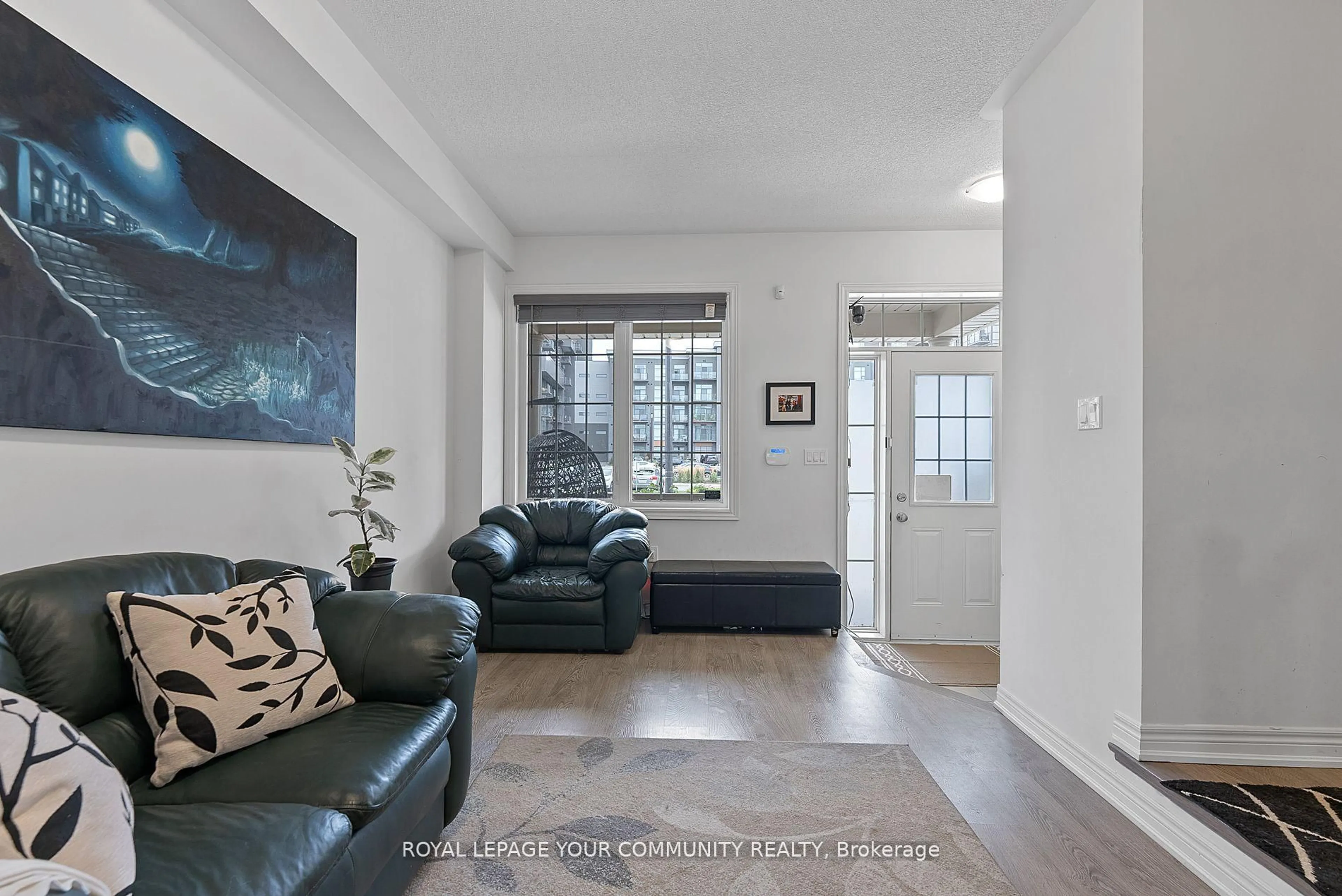 Living room with furniture, unknown for 63 Riverwalk Dr, Hamilton Ontario L8B 1X3