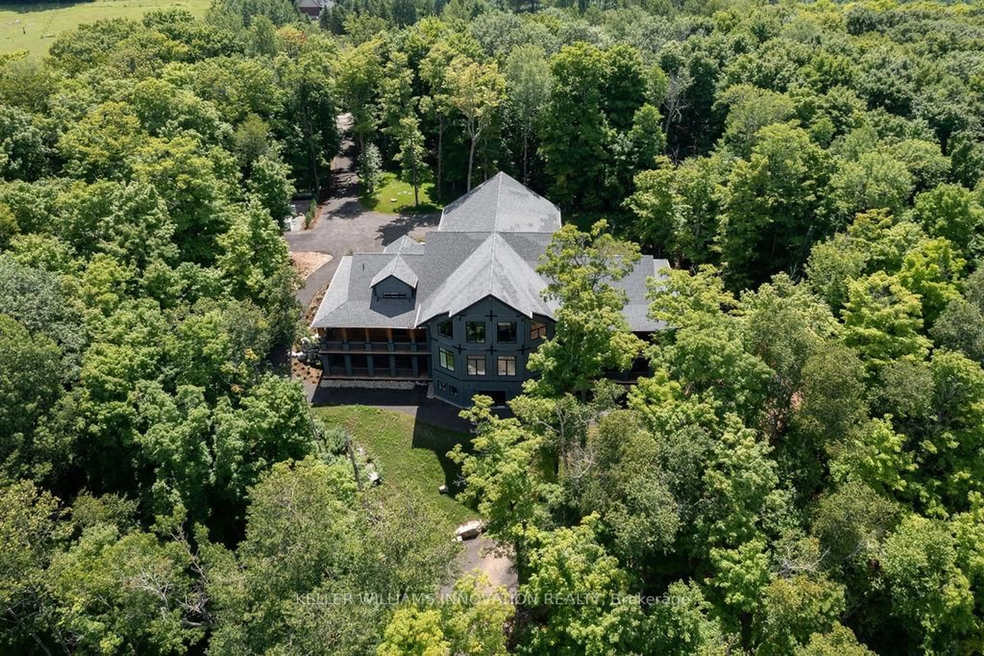 A pic from outside/outdoor area/front of a property/back of a property/a pic from drone, forest/trees view for 84 Swallowdale Rd, Huntsville Ontario P1H 0A5