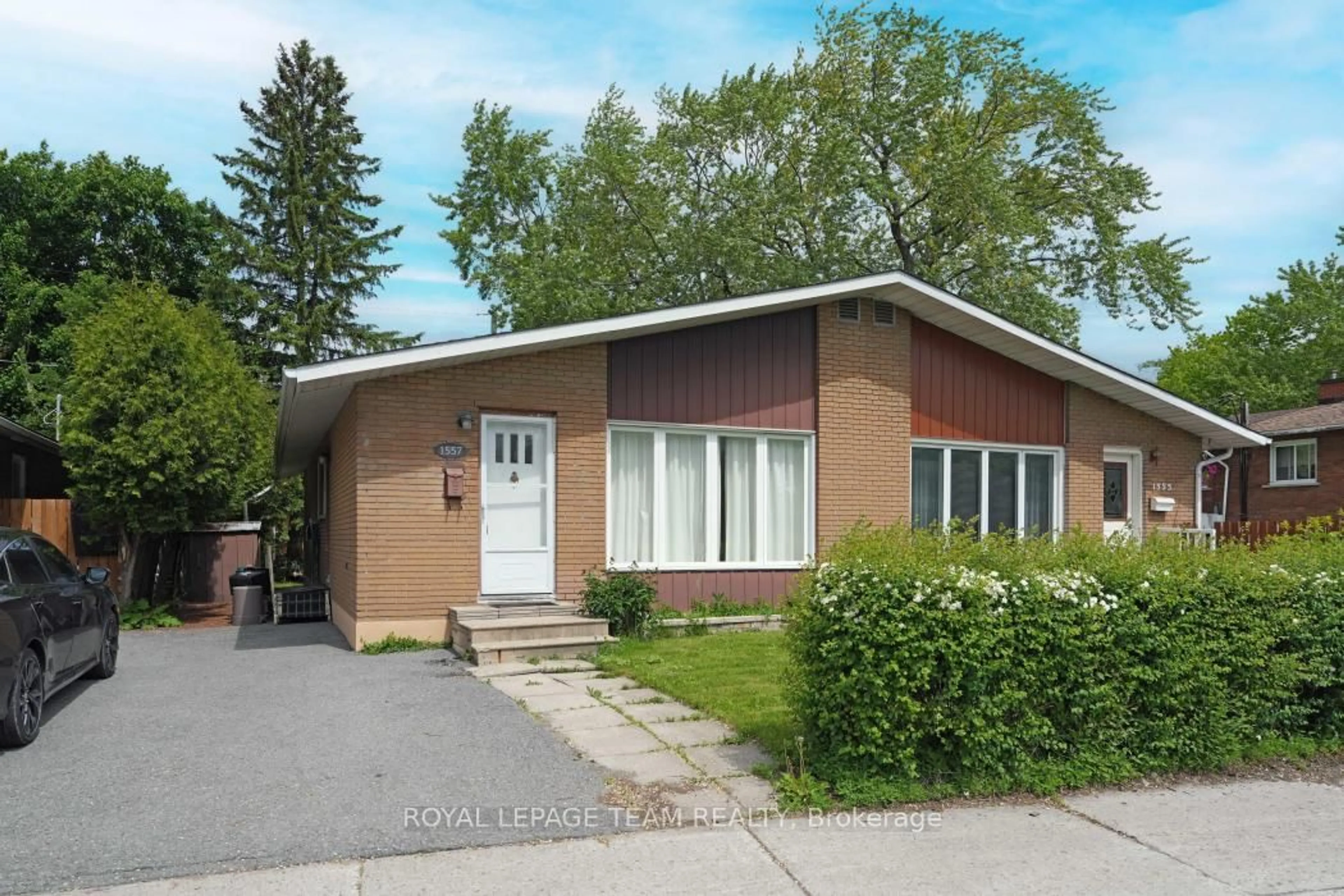 Home with brick exterior material, street for 1557 Baseline Rd, Ottawa Ontario K2C 0B4