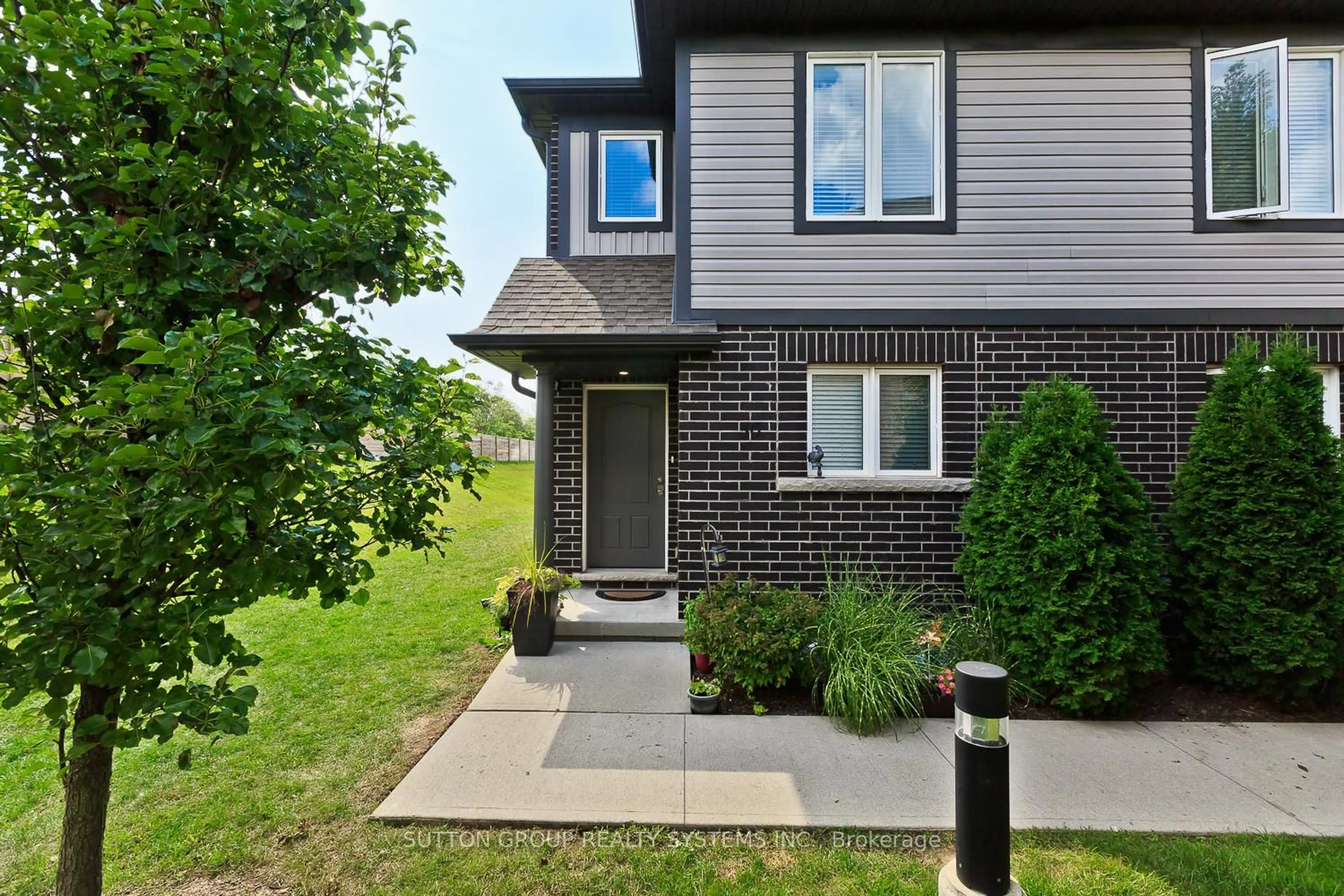 Home with brick exterior material, street for 7768 Ascot Circ #50, Niagara Falls Ontario L2H 3P9