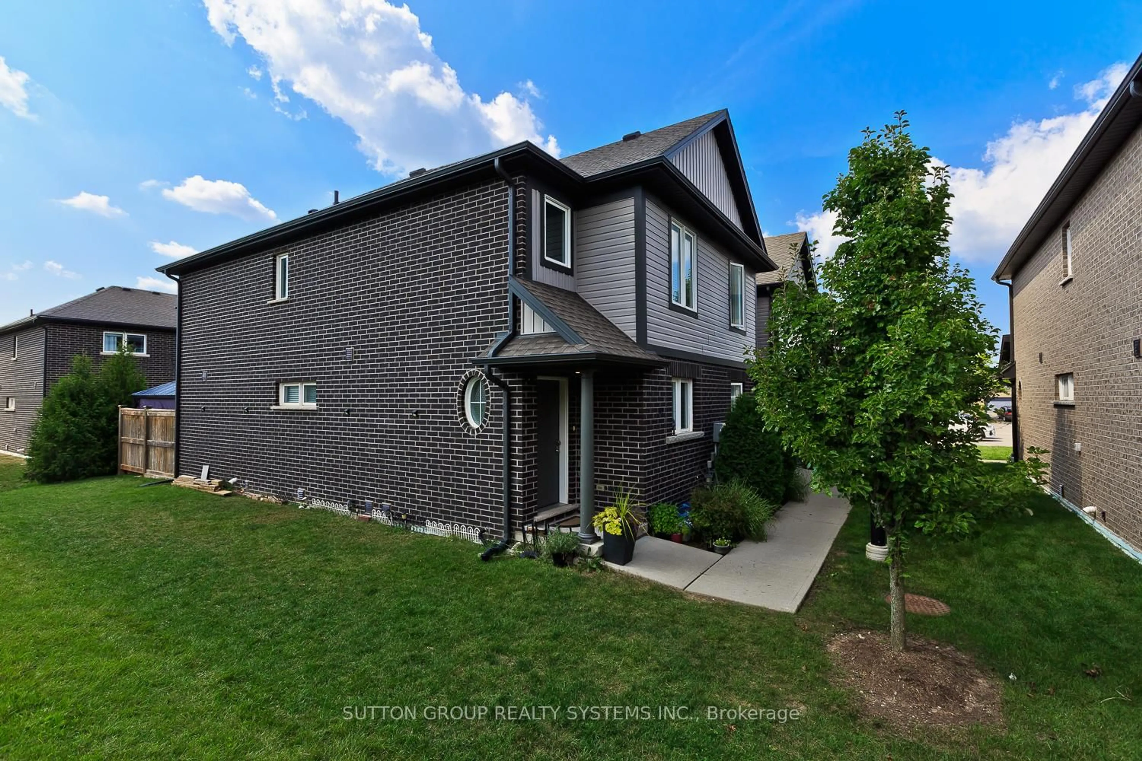 Home with brick exterior material, street for 7768 Ascot Circ #50, Niagara Falls Ontario L2H 3P9