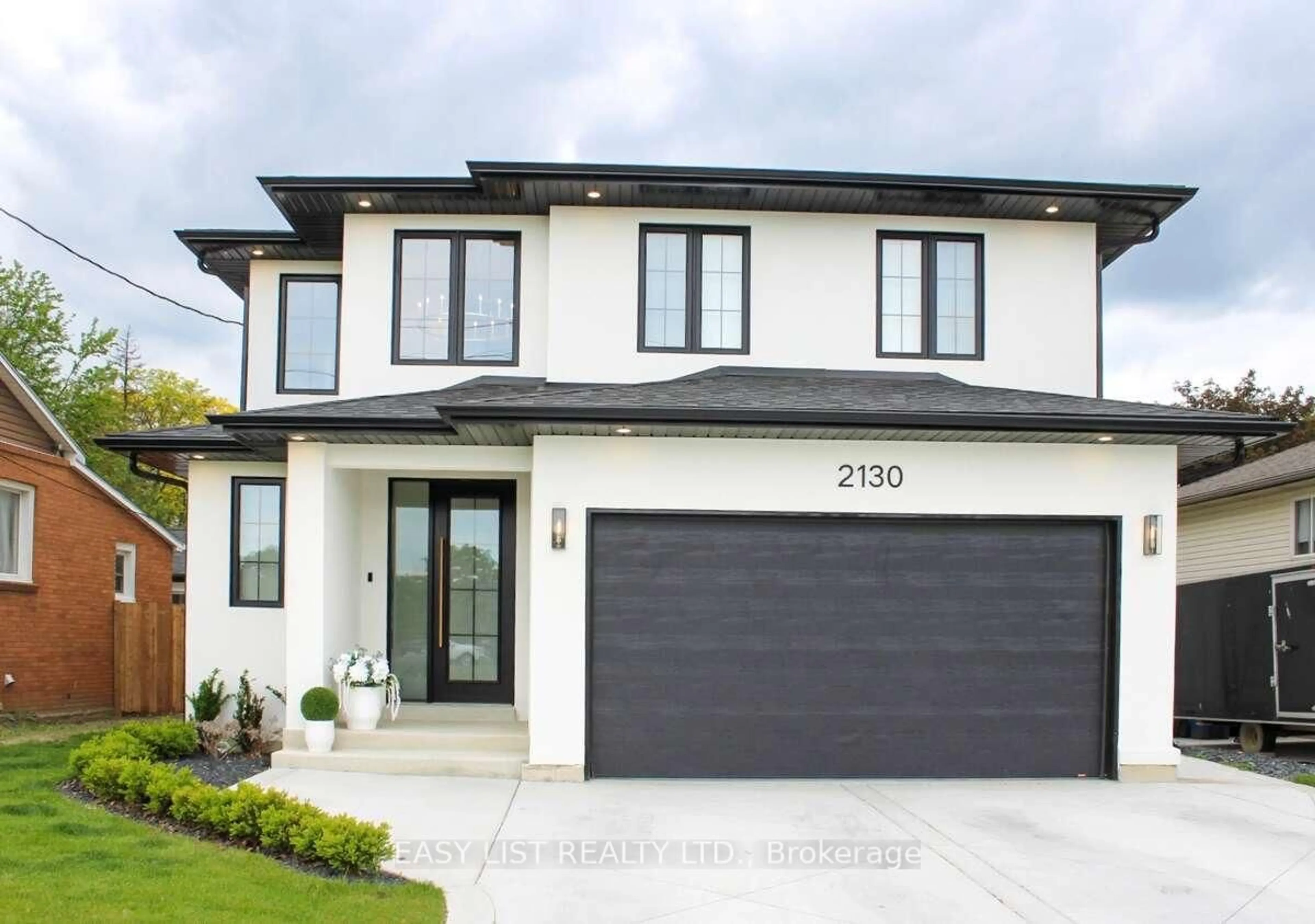 Home with vinyl exterior material, street for 2130 Cabana Rd, Windsor Ontario N9G 1E1
