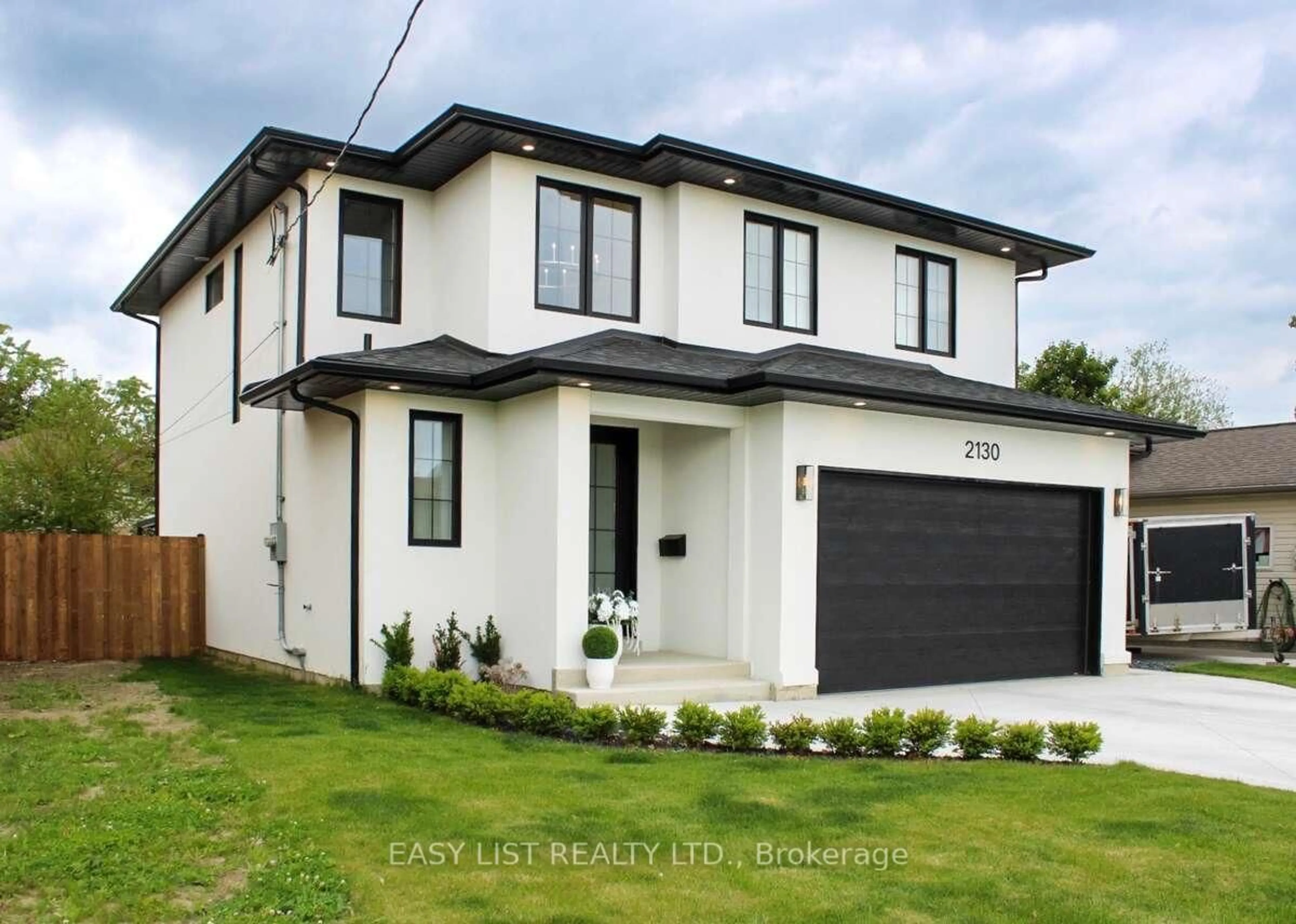 Home with brick exterior material, street for 2130 Cabana Rd, Windsor Ontario N9G 1E1
