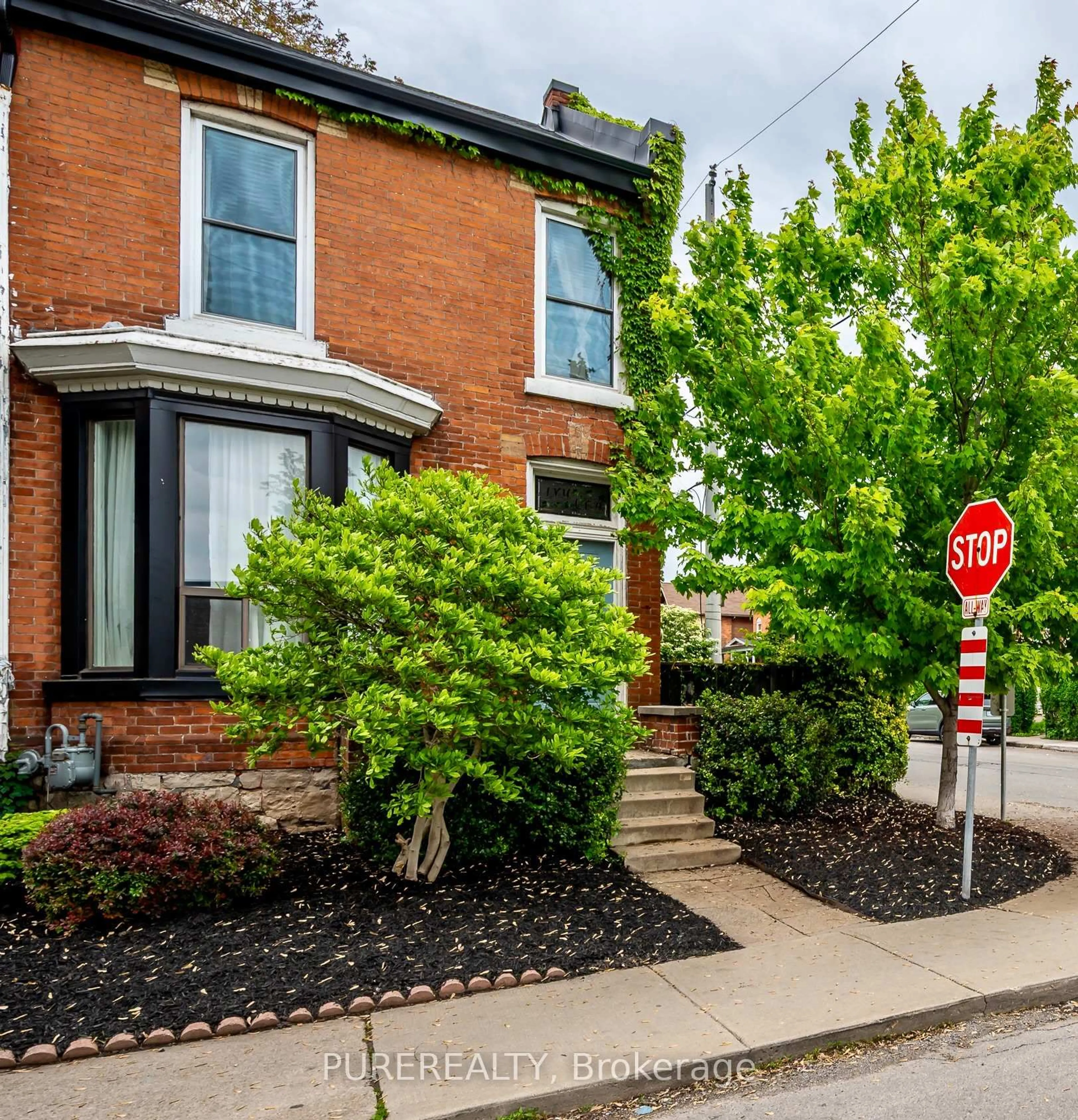 Home with brick exterior material, street for 29 Emerald St, Hamilton Ontario L8L 5J9