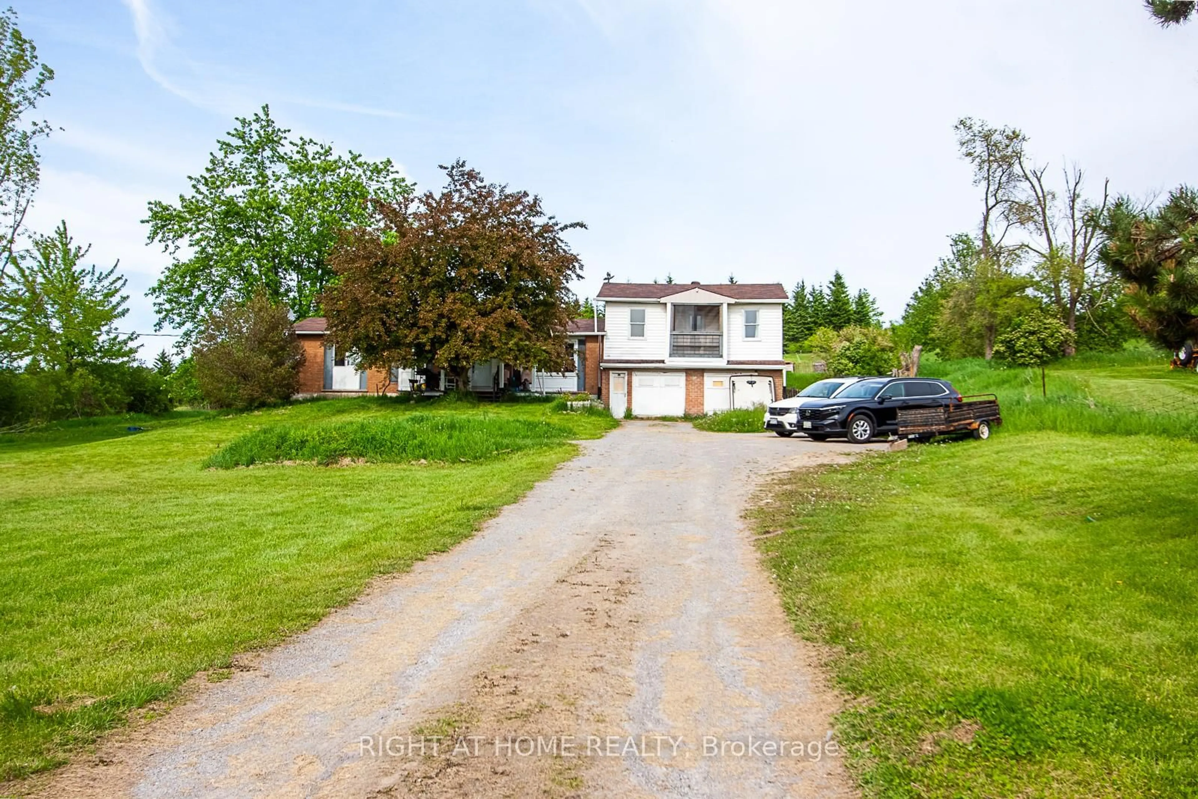 A pic from outside/outdoor area/front of a property/back of a property/a pic from drone, street for 692 Emily Park Rd, Kawartha Lakes Ontario K0L 2W0