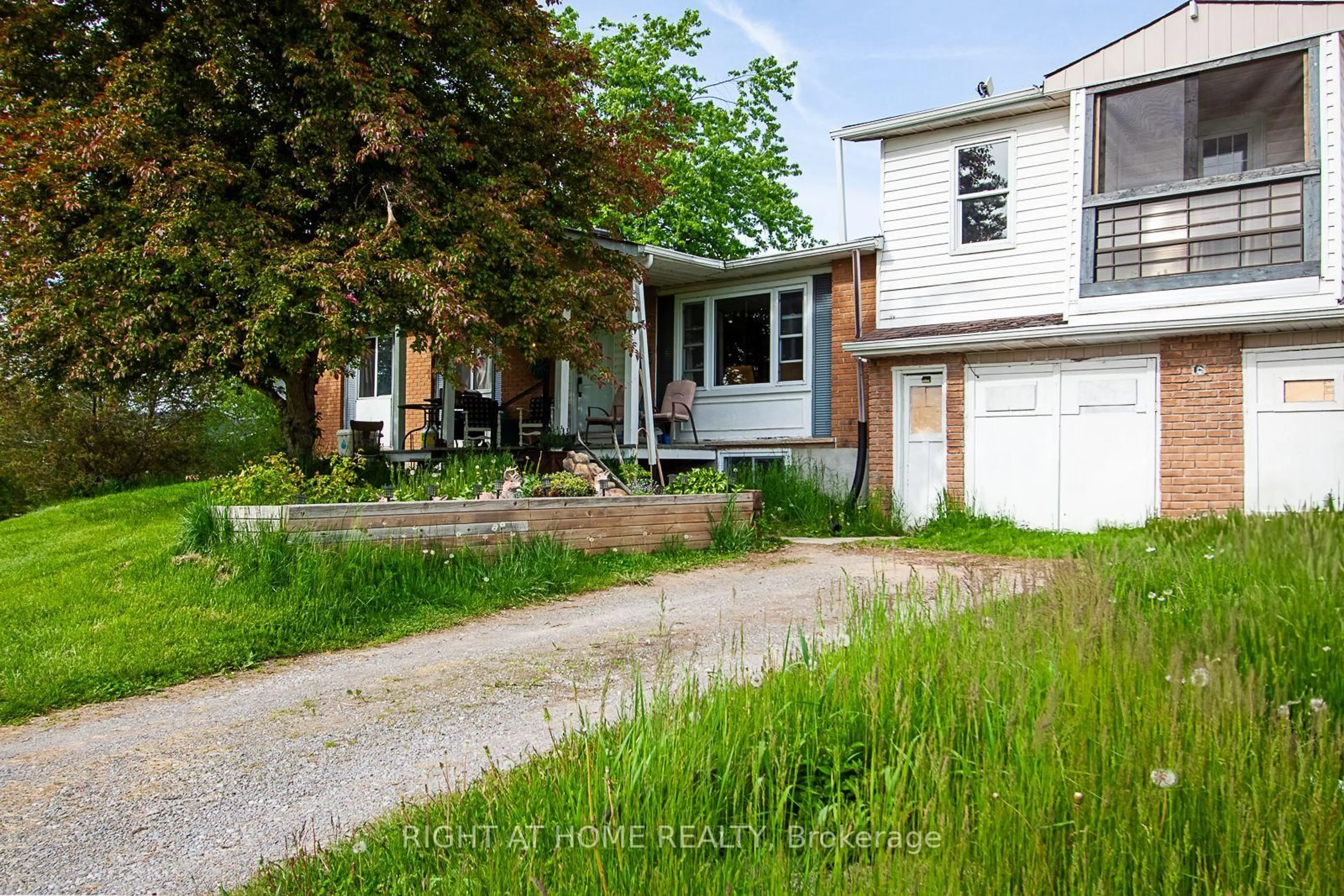 A pic from outside/outdoor area/front of a property/back of a property/a pic from drone, street for 692 Emily Park Rd, Kawartha Lakes Ontario K0L 2W0