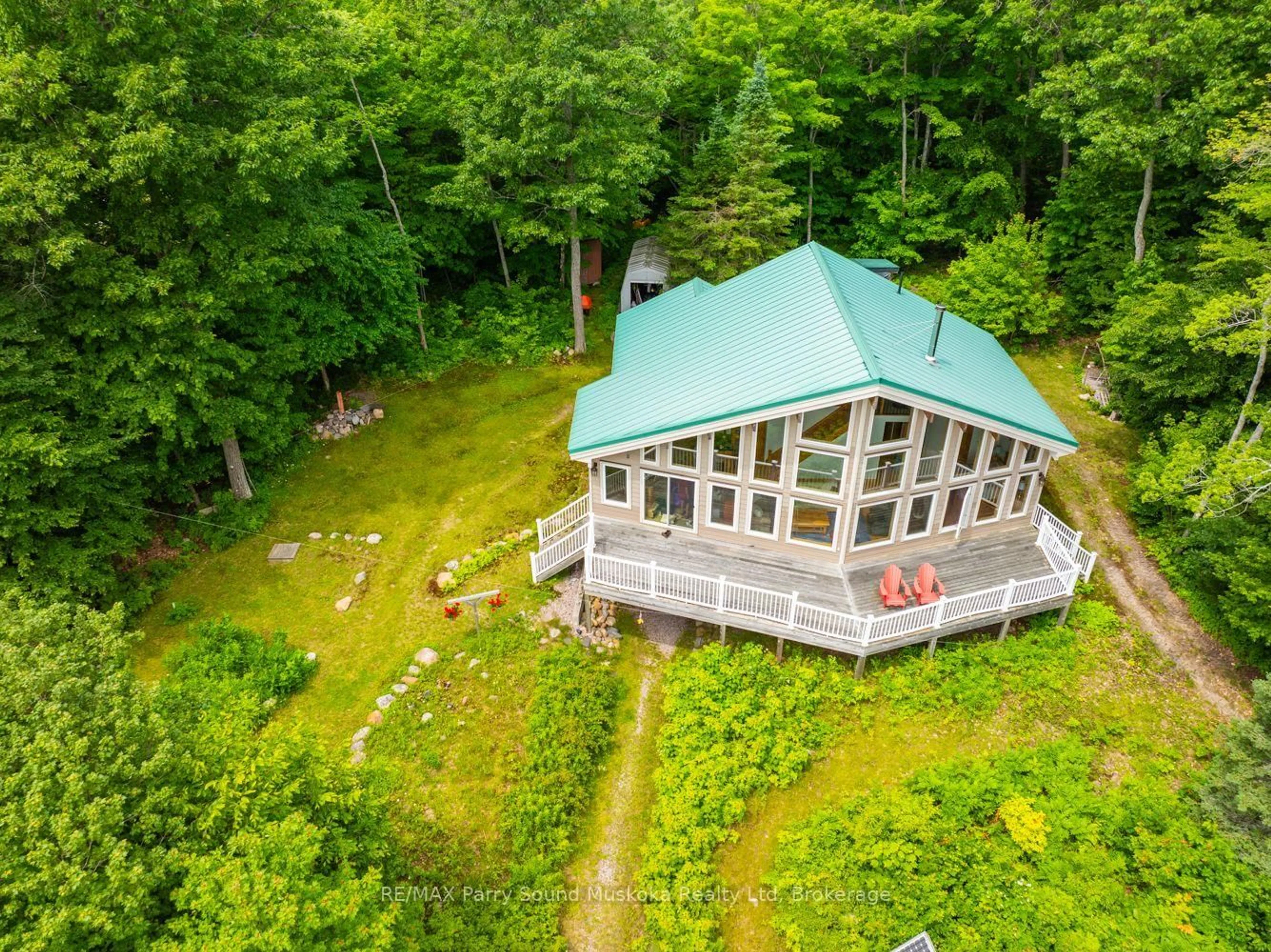 A pic from outside/outdoor area/front of a property/back of a property/a pic from drone, water/lake/river/ocean view for 53 Sandy Island, Carling Ontario P2A 0B7