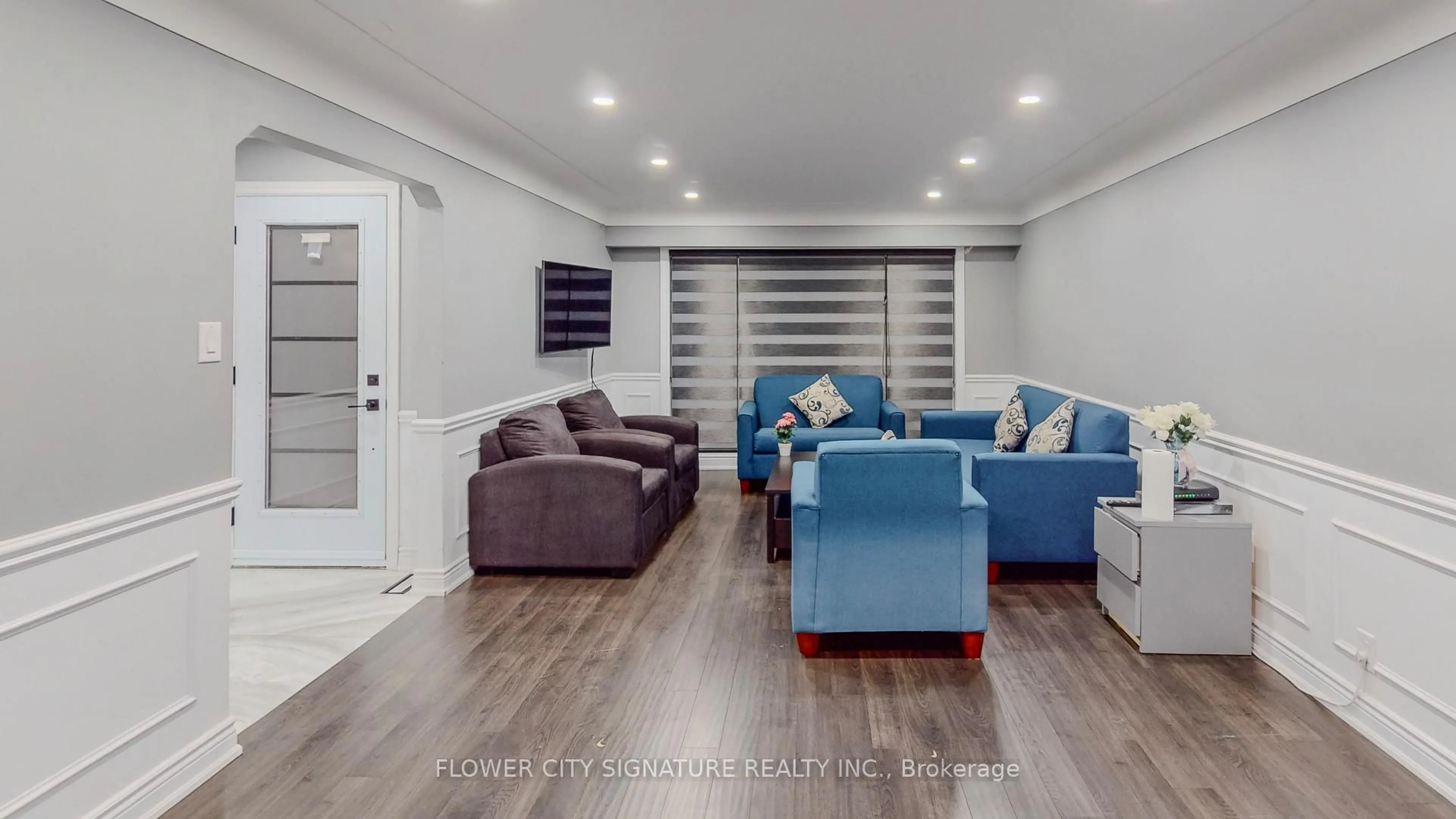 Living room with furniture, wood/laminate floor for 11 Rita St, Hamilton Ontario L9H 4S1