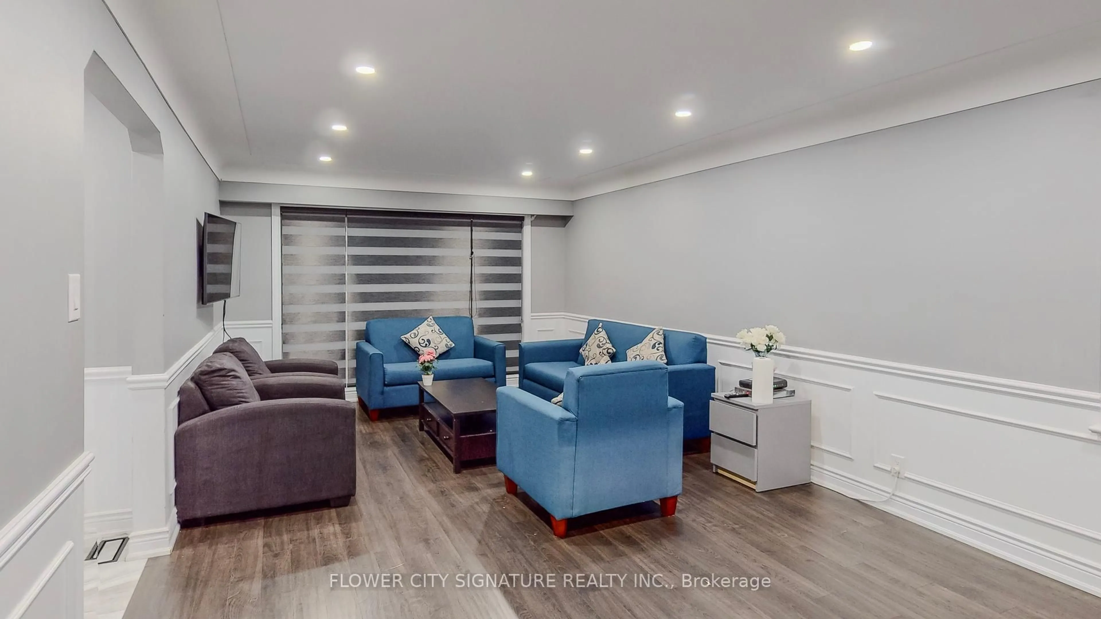 Living room with furniture, wood/laminate floor for 11 Rita St, Hamilton Ontario L9H 4S1