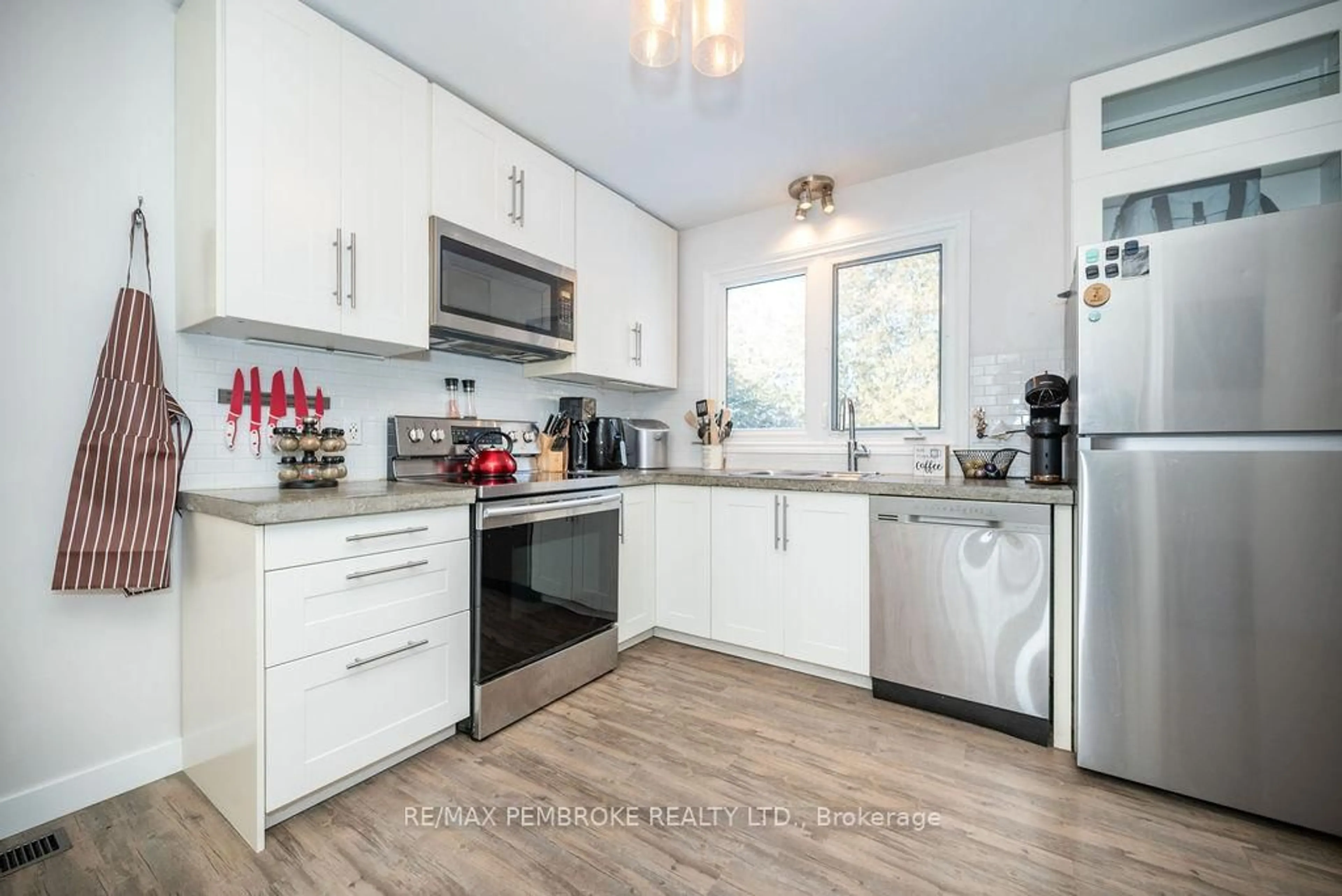 Open concept kitchen, wood/laminate floor for 13 Highland Cres, Deep River Ontario K0J 1P0