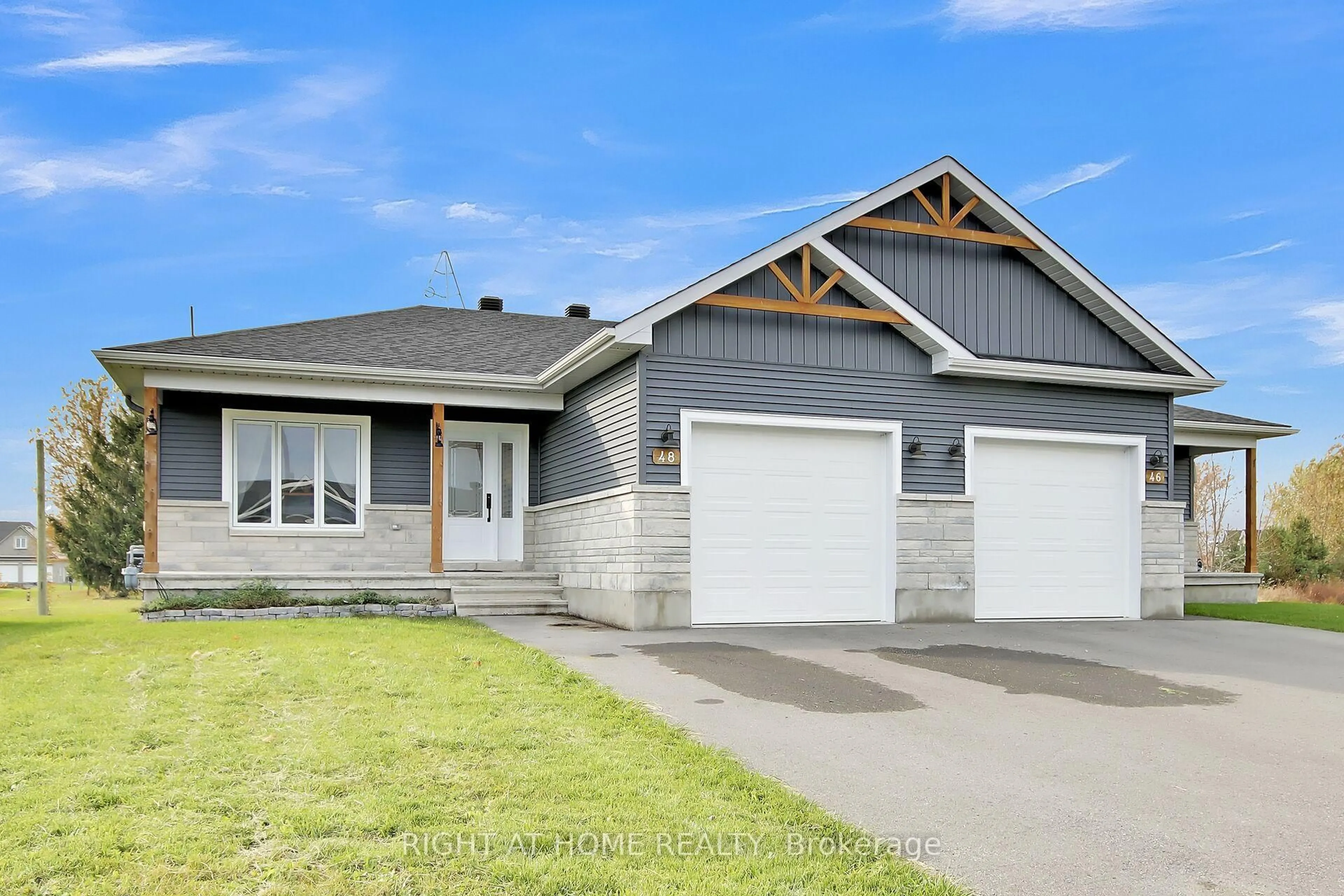 Home with vinyl exterior material, street for 48 Adam St, The Nation Ontario K0A 3C0
