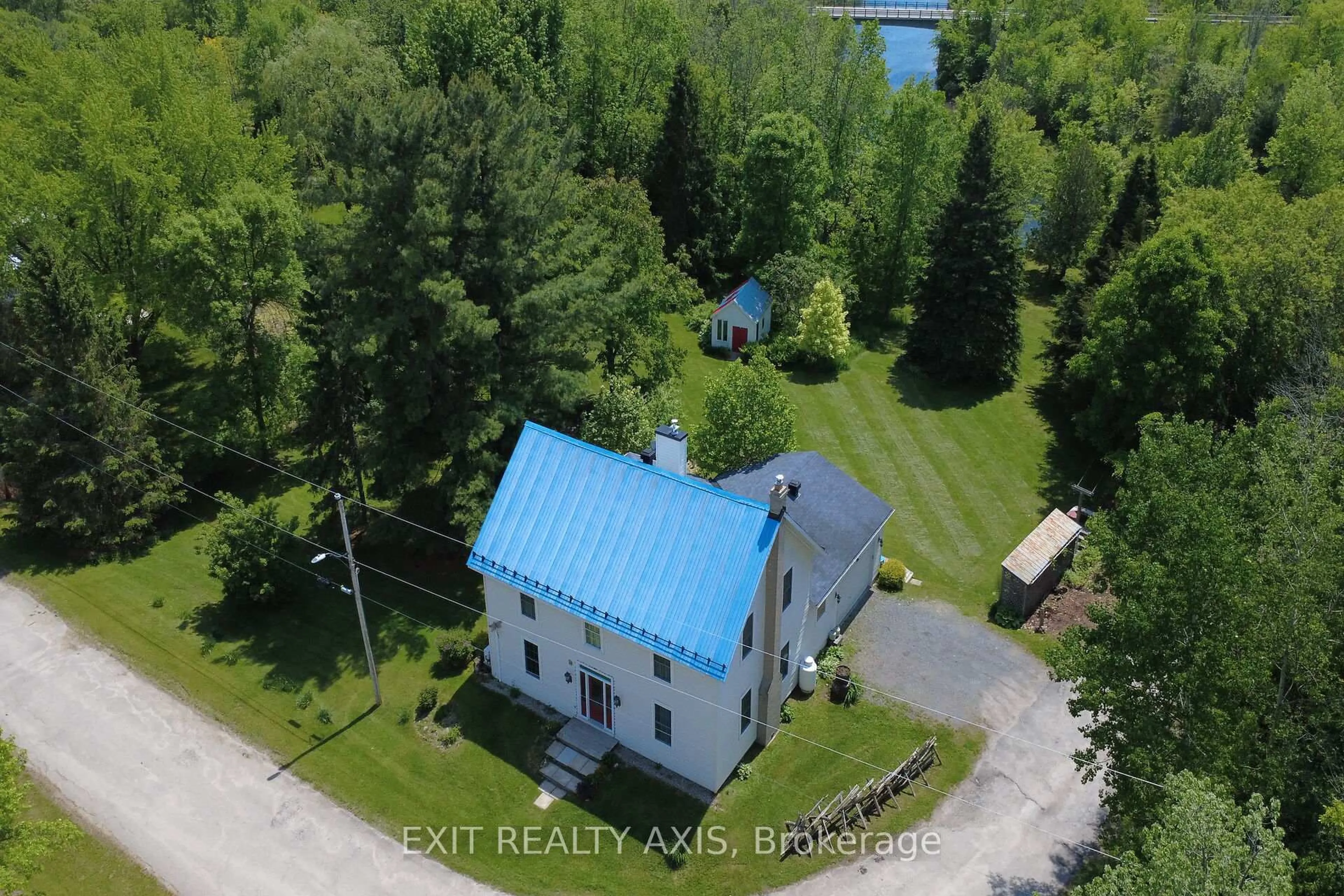 A pic from outside/outdoor area/front of a property/back of a property/a pic from drone, water/lake/river/ocean view for 21 Main St, Rideau Lakes Ontario K0G 1P0