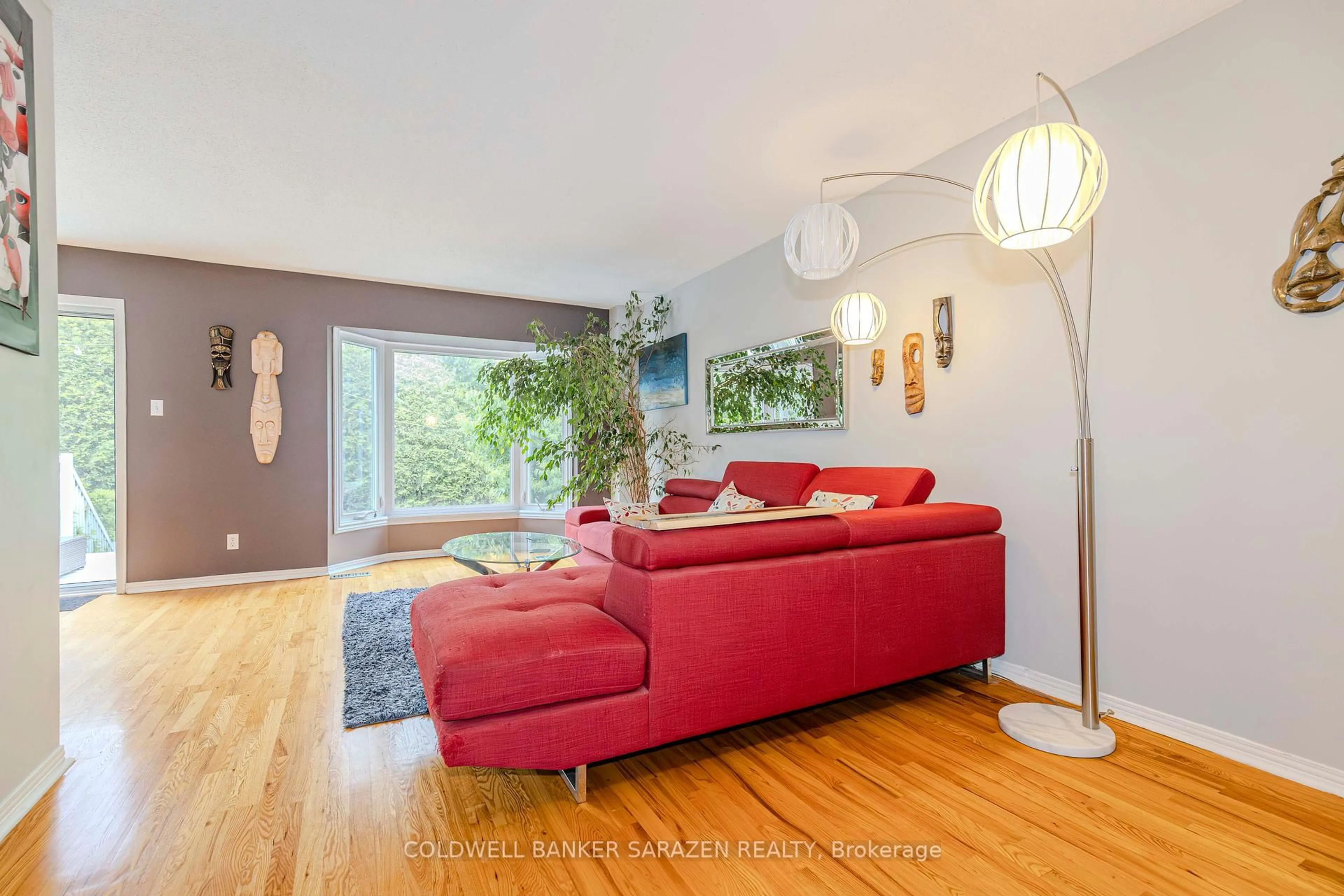 Living room with furniture, wood/laminate floor for 22 Crimson Gate, Ottawa Ontario K1T 1Z6