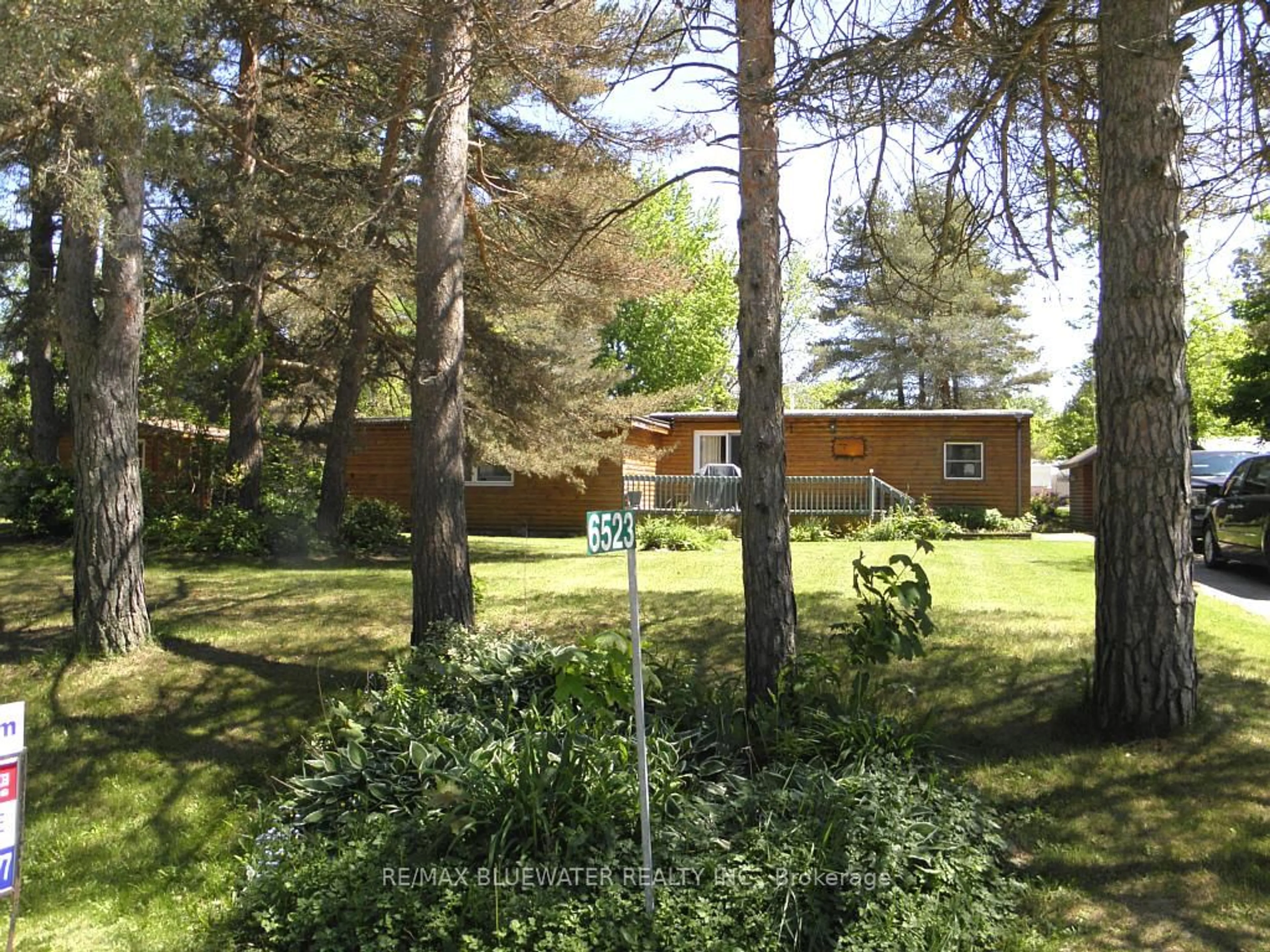 A pic from outside/outdoor area/front of a property/back of a property/a pic from drone, forest/trees view for 6523 West Parkway Dr, Lambton Shores Ontario N0N 1J2