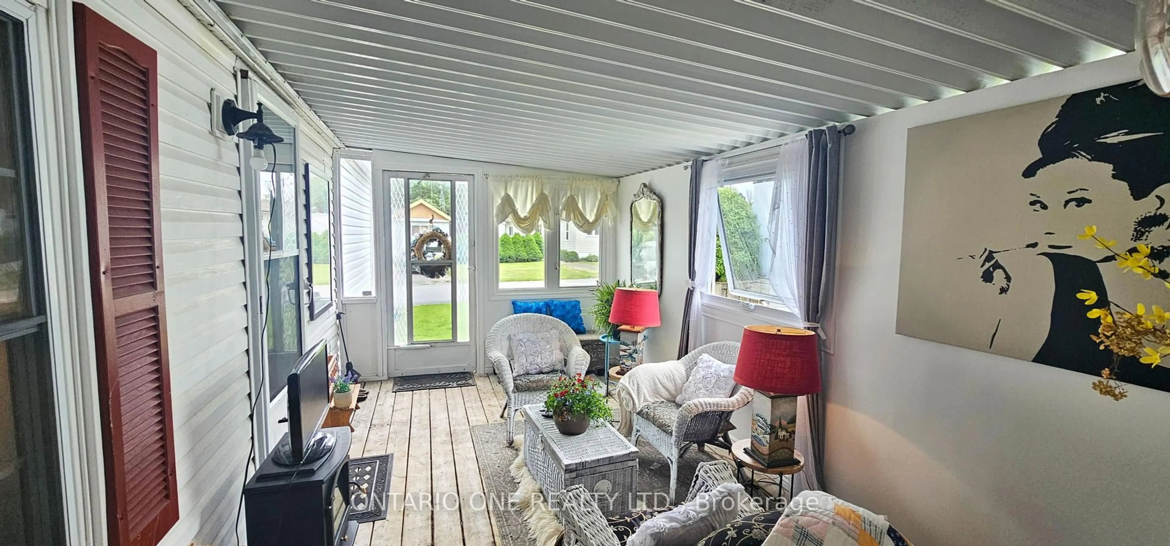 Living room with furniture, wood/laminate floor for 2244 Heritage Line #17A, Otonabee-South Monaghan Ontario K9J 6X8